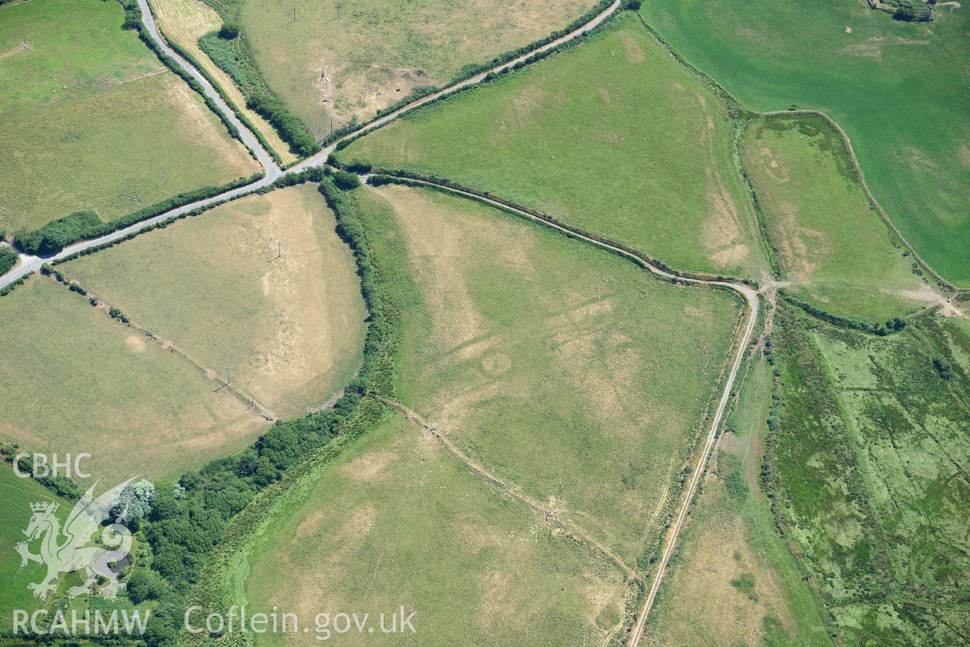 Aerial photograph: Llawr-Dref cropmark complex and barrows. Crown: CHERISH PROJECT 2018. Produced with EU funds through the Ireland Wales Co-operation Programme 2014-2020 (NGR SH291285)