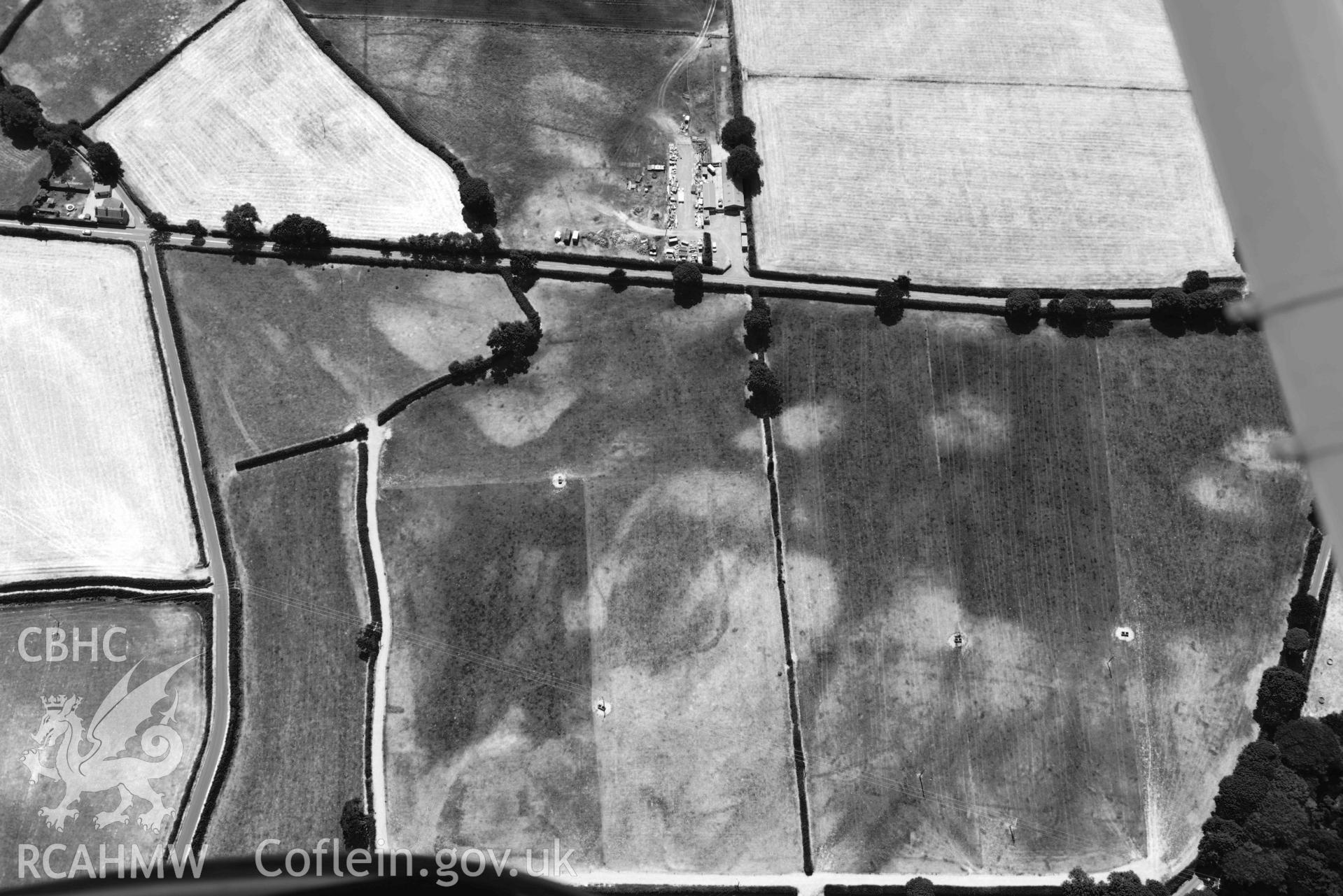 Aerial photograph: Enclosures and early field system cropmarks, Cefail y Bont, Efailnewydd. Crown: CHERISH PROJECT 2018. Produced with EU funds through the Ireland Wales Co-operation Programme 2014-2020 (NGR SH347365)