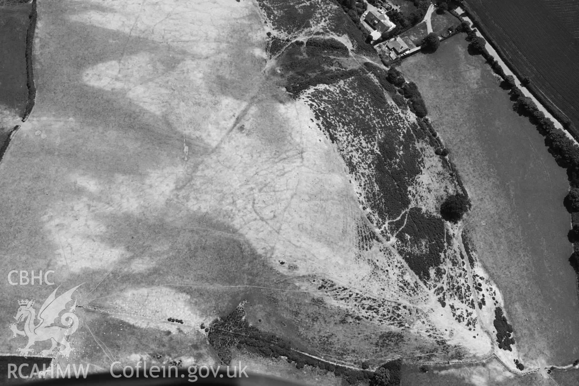 Aerial photograph: Llangian: cropmarks of early promontory enclosure, from north. Crown: CHERISH PROJECT 2018. Produced with EU funds through the Ireland Wales Co-operation Programme 2014-2020 (NGR SH294292)