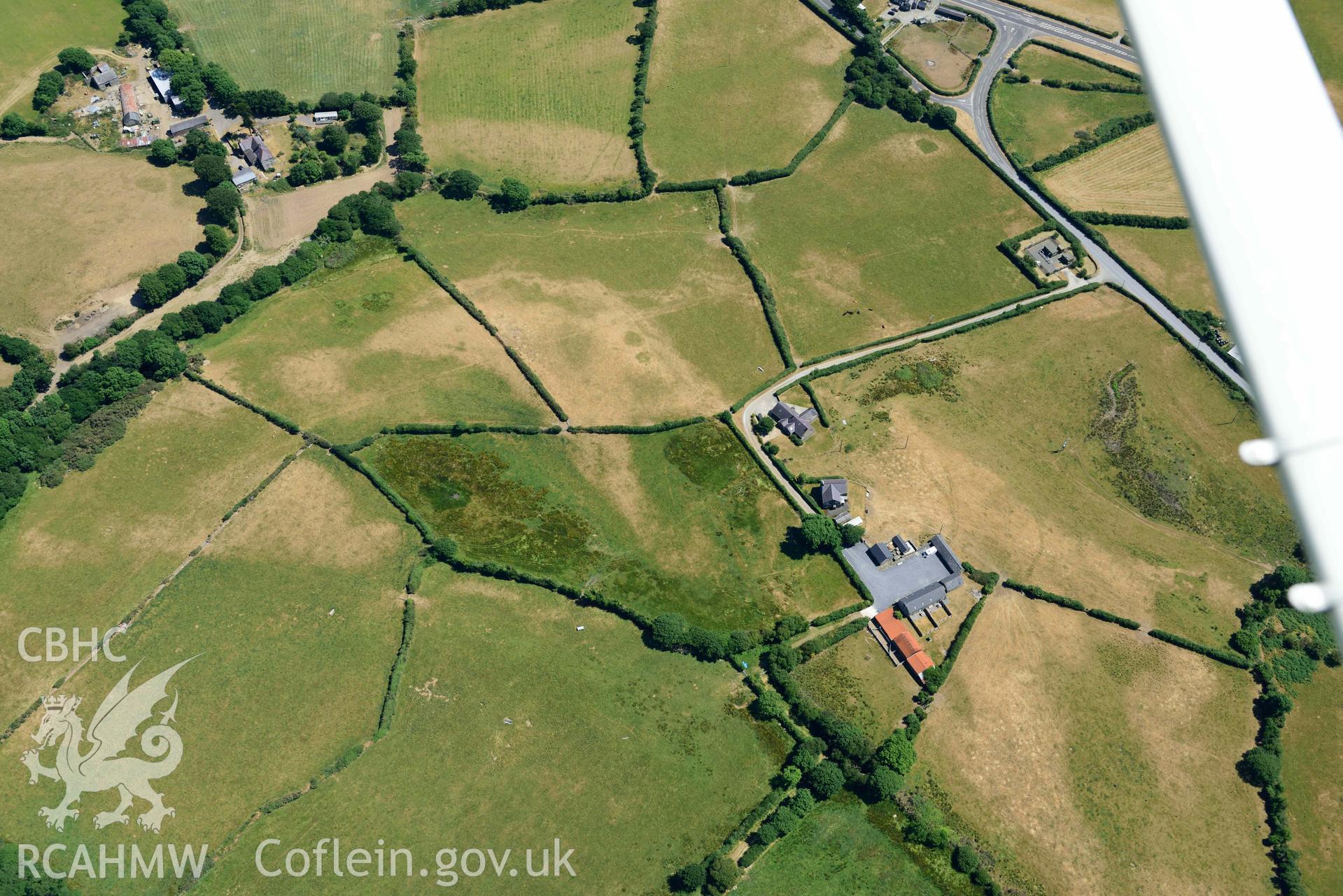 Aerial photograph: Bryn-Marsli cropmark enclosure. Crown: CHERISH PROJECT 2018. Produced with EU funds through the Ireland Wales Co-operation Programme 2014-2020 (NGR SH449380)