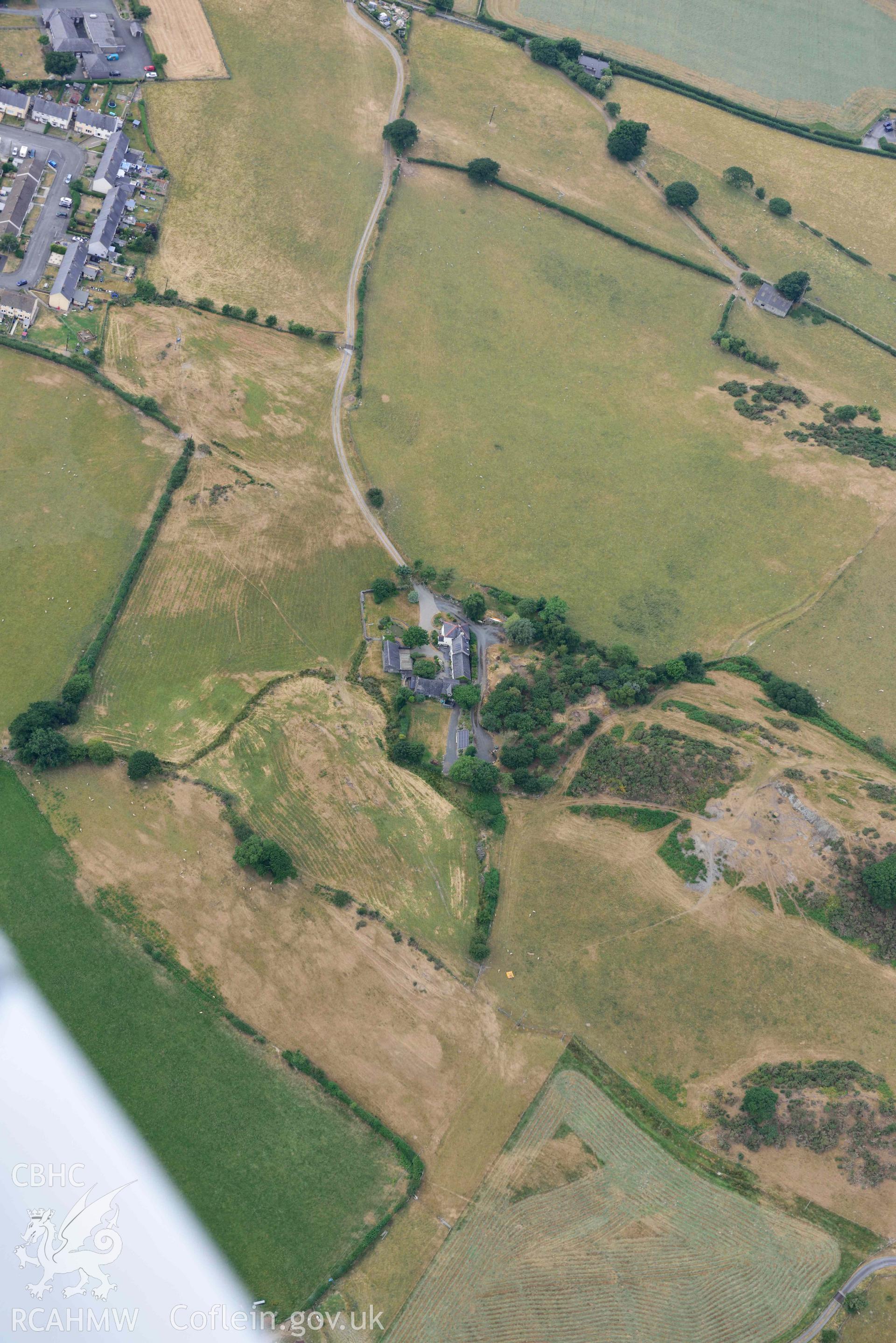 Aerial photograph: Braichyrhenllys, parchmarks of ring ditch or circular enclosure south-east of farm. Crown: CHERISH PROJECT 2018. Produced with EU funds through the Ireland Wales Co-operation Programme 2014-2020 (NGR SH615034)