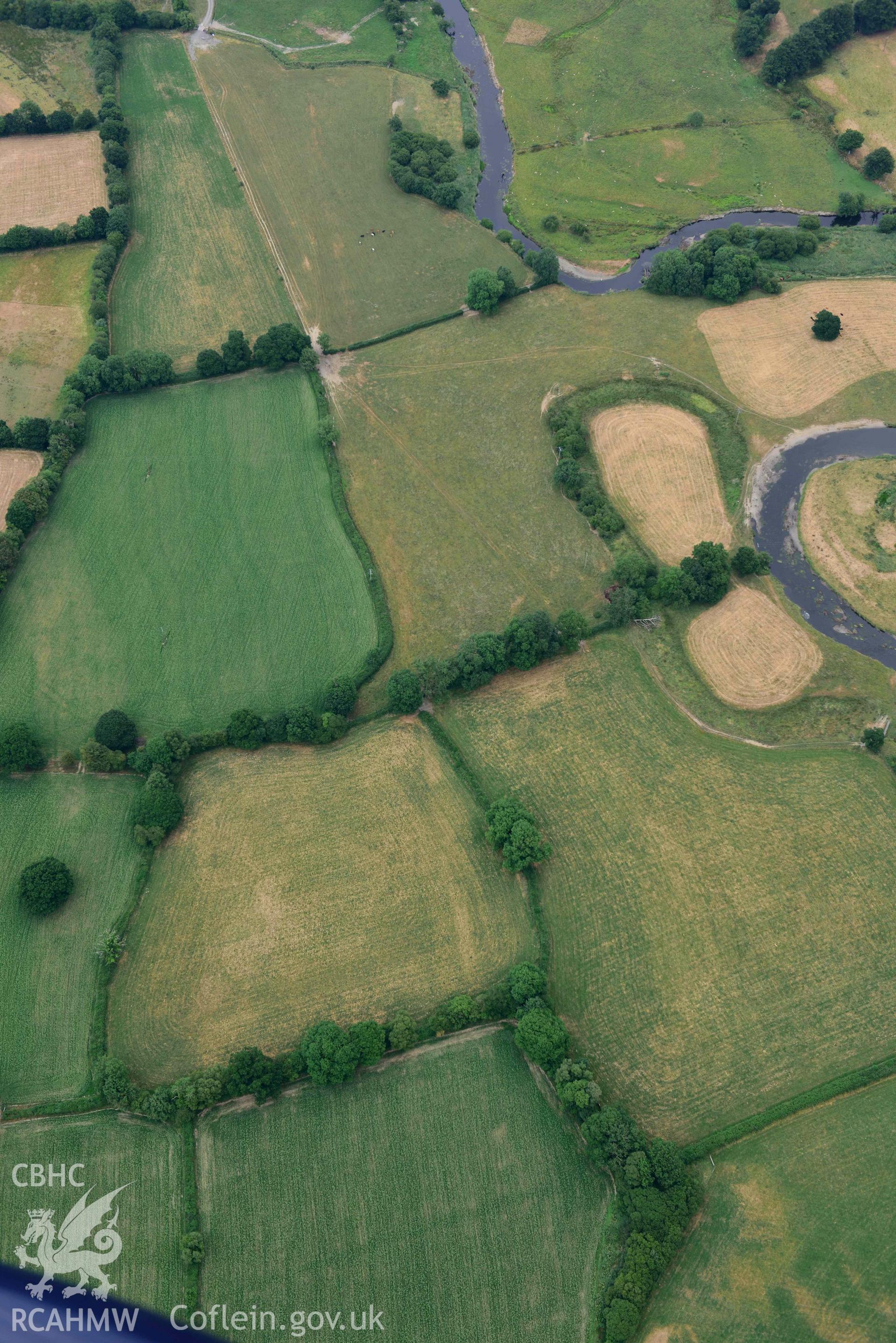 Aerial photograph: Lampeter Common Roman road, view from west with parchmarks. Crown: CHERISH PROJECT 2018. Produced with EU funds through the Ireland Wales Co-operation Programme 2014-2020 (NGR SN567471)