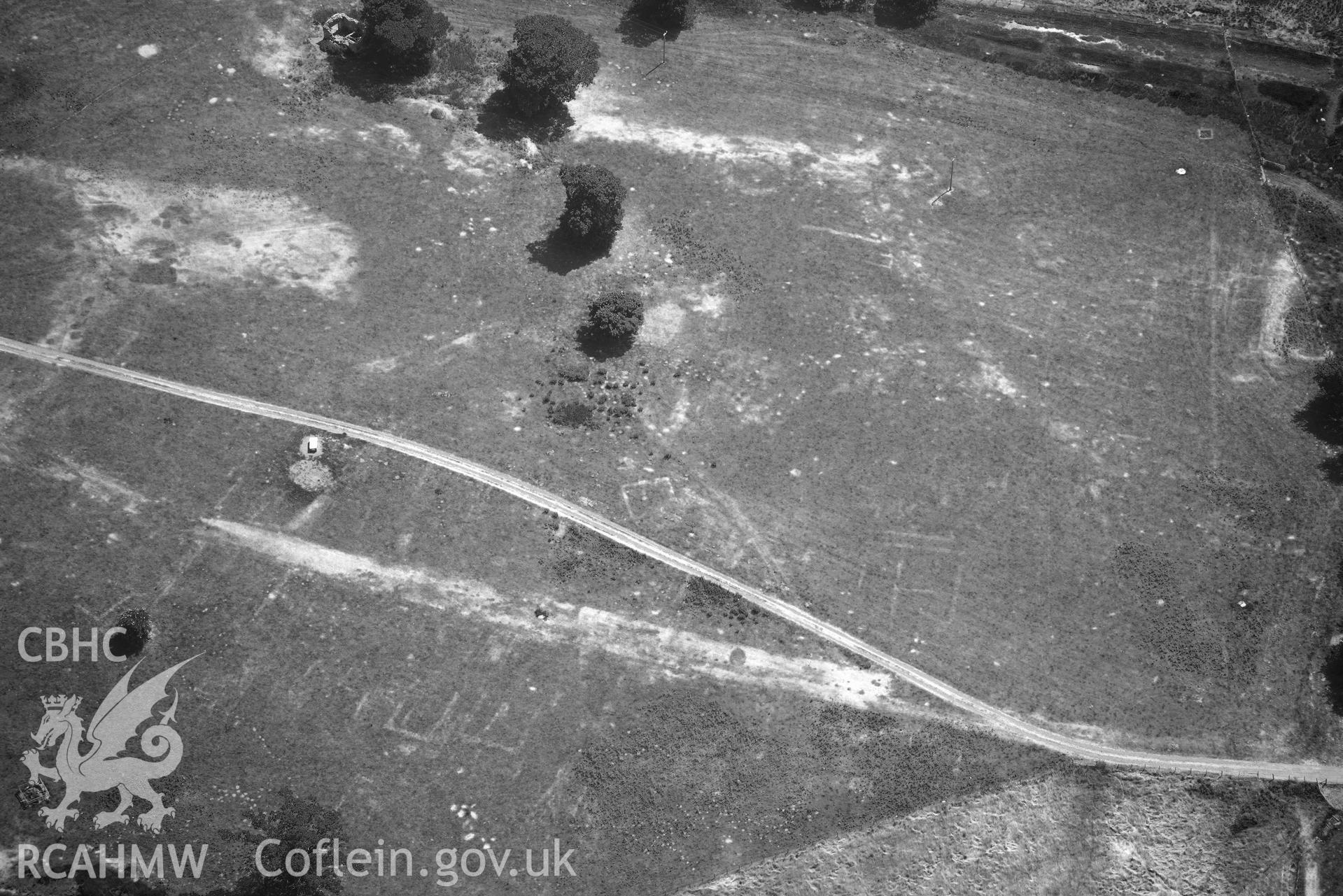 Aerial photograph: Caerhun Roman fort, with extensive parchmarks, view over vicus. Crown: CHERISH PROJECT 2018. Produced with EU funds through the Ireland Wales Co-operation Programme 2014-2020 (NGR: SH776703)