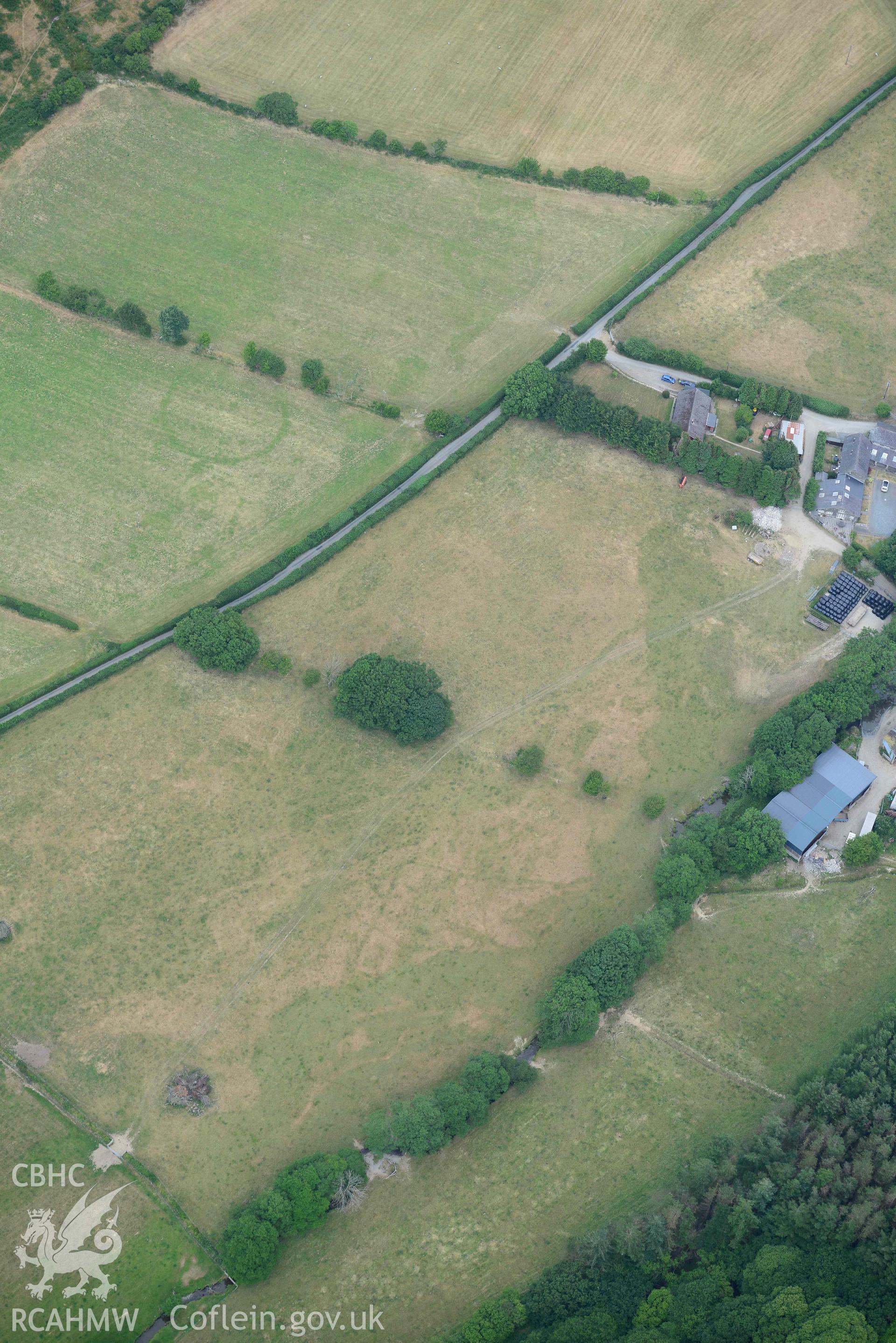 Aerial photograph: Allt-lwyd, Cwm Maethlon round barrow cropmarks. Crown: CHERISH PROJECT 2018. Produced with EU funds through the Ireland Wales Co-operation Programme 2014-2020 (NGR SH631985)