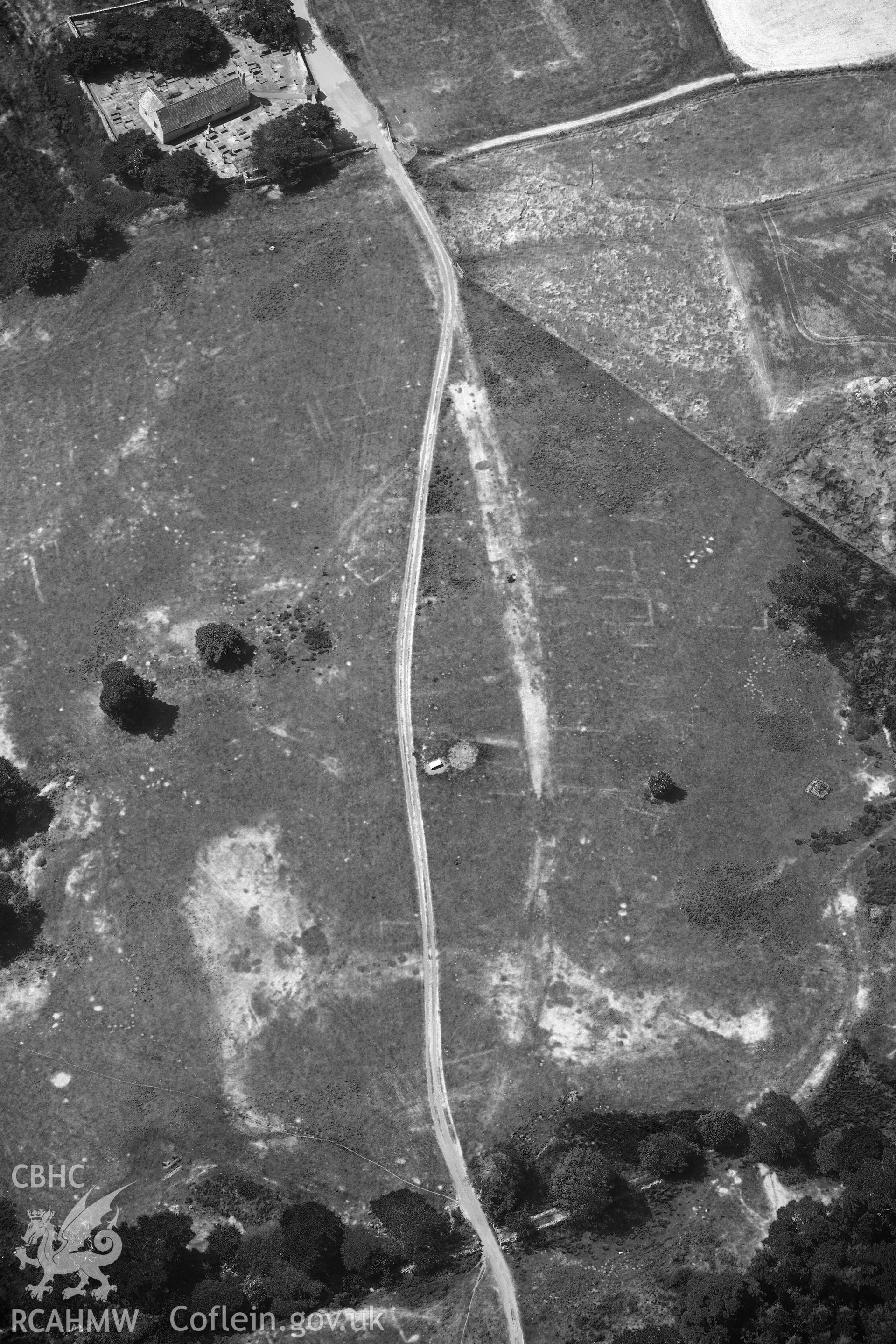 Aerial photograph: Caerhun Roman fort, with extensive parchmarks, view over vicus from north. Crown: CHERISH PROJECT 2018. Produced with EU funds through the Ireland Wales Co-operation Programme 2014-2020 (NGR: SH776703)