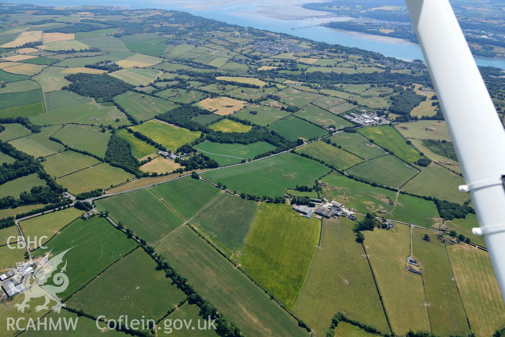 Aerial photograph: Castellior circular and rectangular cropmarks, view looking east. Crown: CHERISH PROJECT 2018. Produced with EU funds through the Ireland Wales Co-operation Programme 2014-2020 (NGR: SH544744)