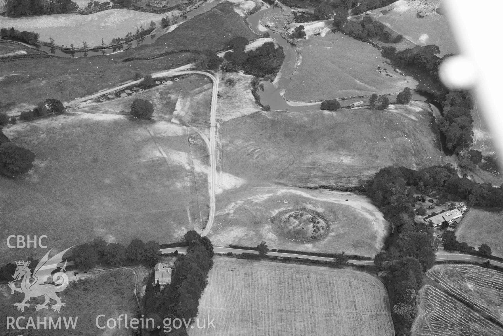 Aerial photograph: Tomen Llanio motte, with parchmarks. Crown: CHERISH PROJECT 2018. Produced with EU funds through the Ireland Wales Co-operation Programme 2014-2020 (NGR SN660579)