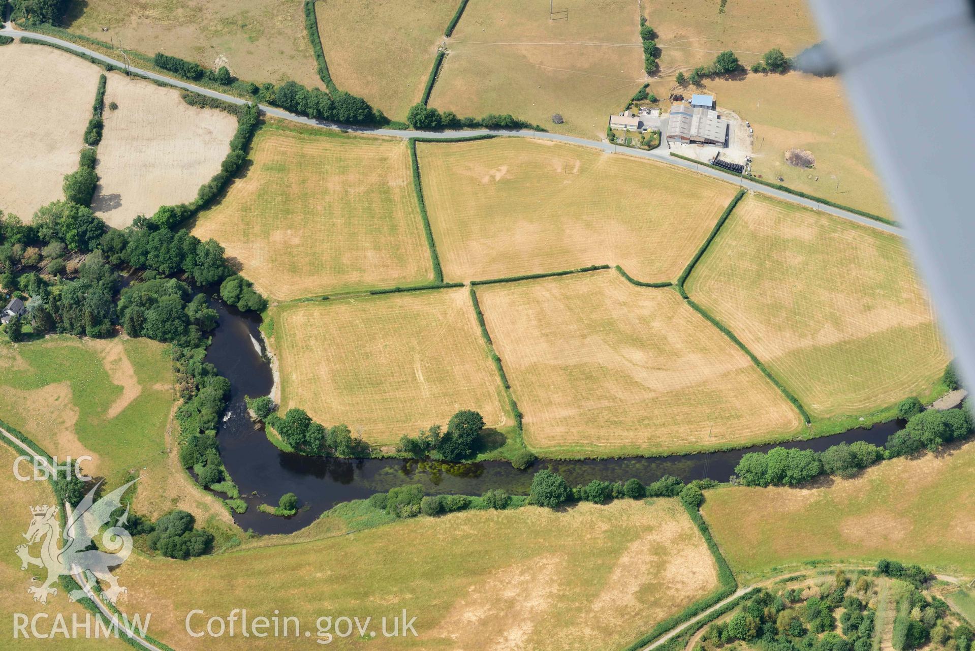 Aerial photograph: Dol-gamlyn, cropmarks of curving linear ditch of uncertain date. Crown: CHERISH PROJECT 2018. Produced with EU funds through the Ireland Wales Co-operation Programme 2014-2020 (NGR SN678789)