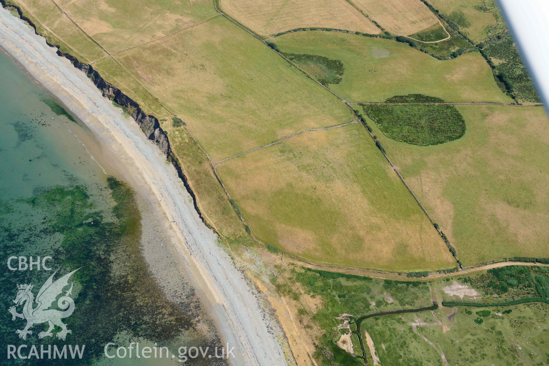 Aerial photograph: Field system south of Dinas Dinlle, view from south-west. Crown: CHERISH PROJECT 2018. Produced with EU funds through the Ireland Wales Co-operation Programme 2014-2020 (NGR: SH436557)