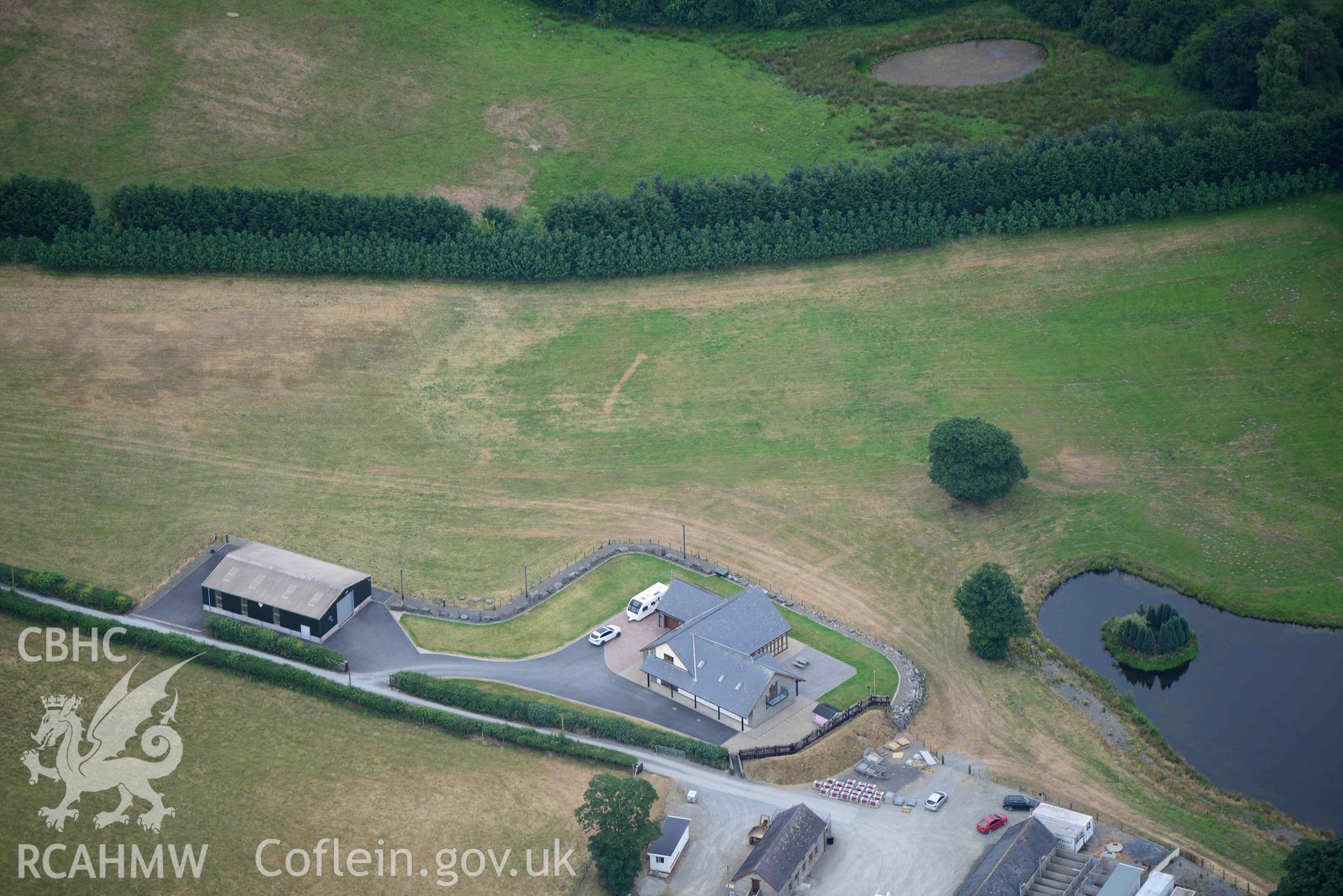 Aerial photograph: Maescanol house (SN53314535), Pencarreg. Parchmarks of ground source heating system installed circa 2011, showing to south of bungalow. Crown: CHERISH PROJECT 2018. Produced with EU funds through the Ireland Wales Co-operation Programme 2014-2020 (NGR SN532453)