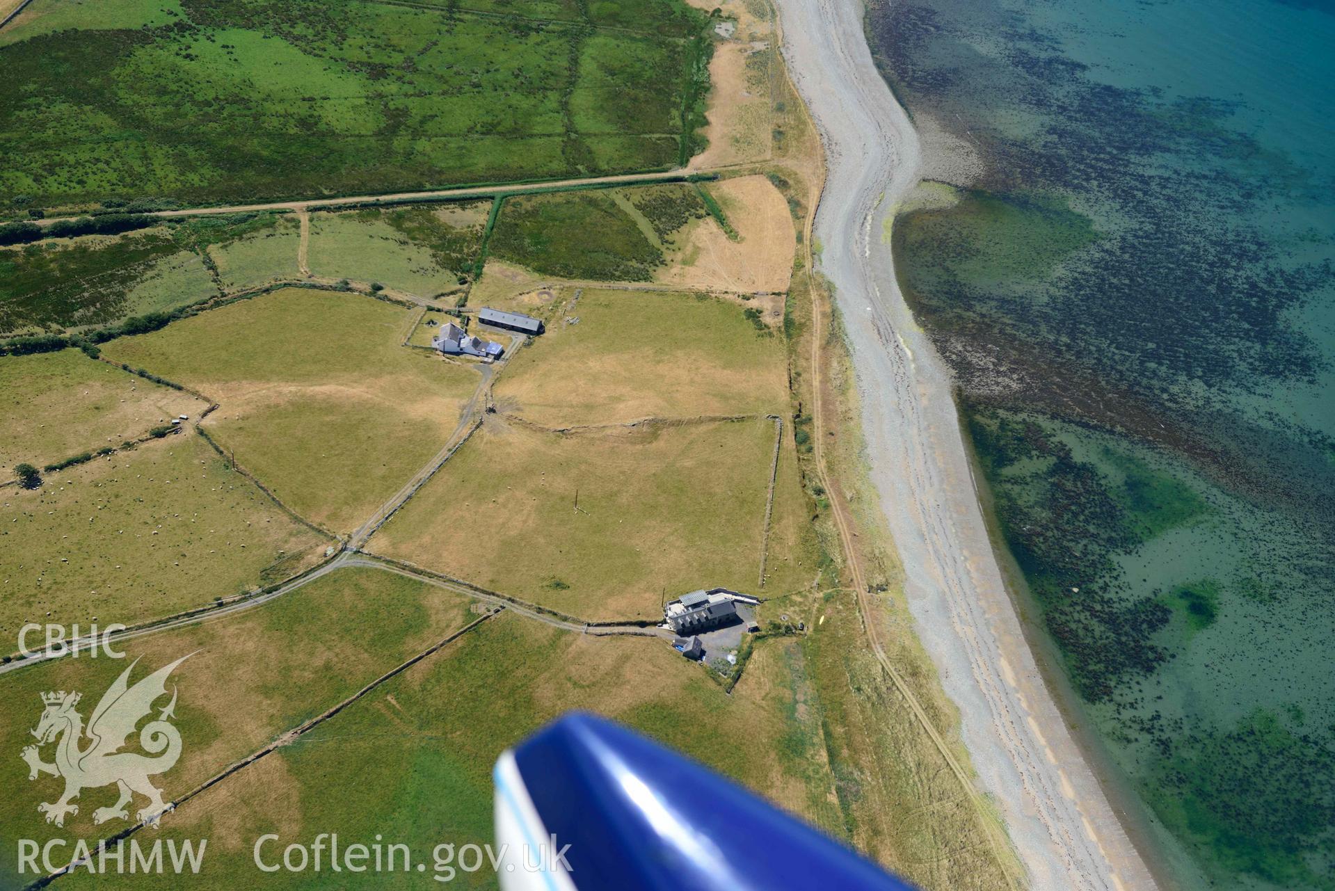 Aerial photograph: Cropmarks of settlement and early fields at Ynys-fach. Crown: CHERISH PROJECT 2018. Produced with EU funds through the Ireland Wales Co-operation Programme 2014-2020 (NGR: SH435544)