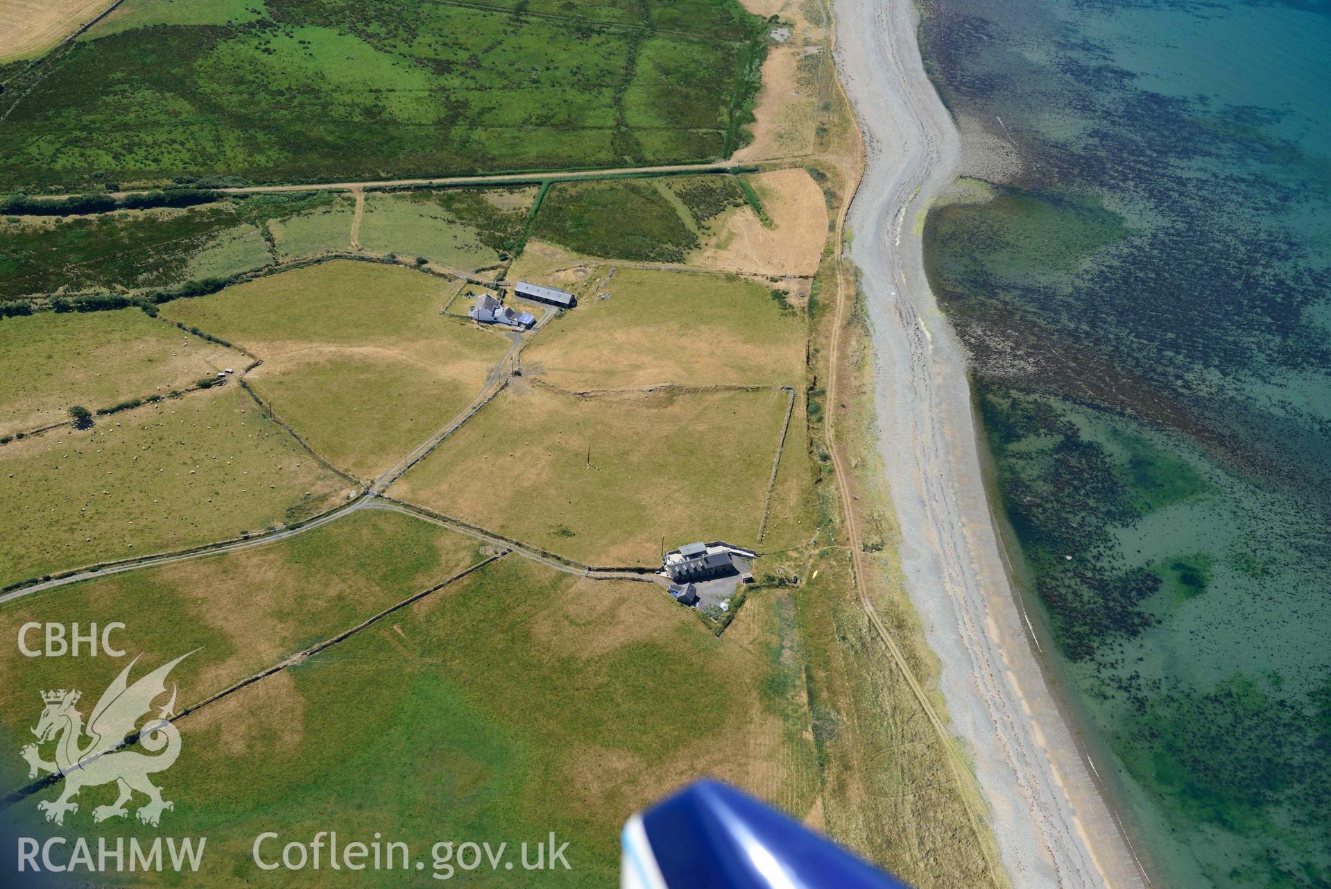 Aerial photograph: Cropmarks of settlement and early fields at Ynys-fach. Crown: CHERISH PROJECT 2018. Produced with EU funds through the Ireland Wales Co-operation Programme 2014-2020 (NGR: SH435544)