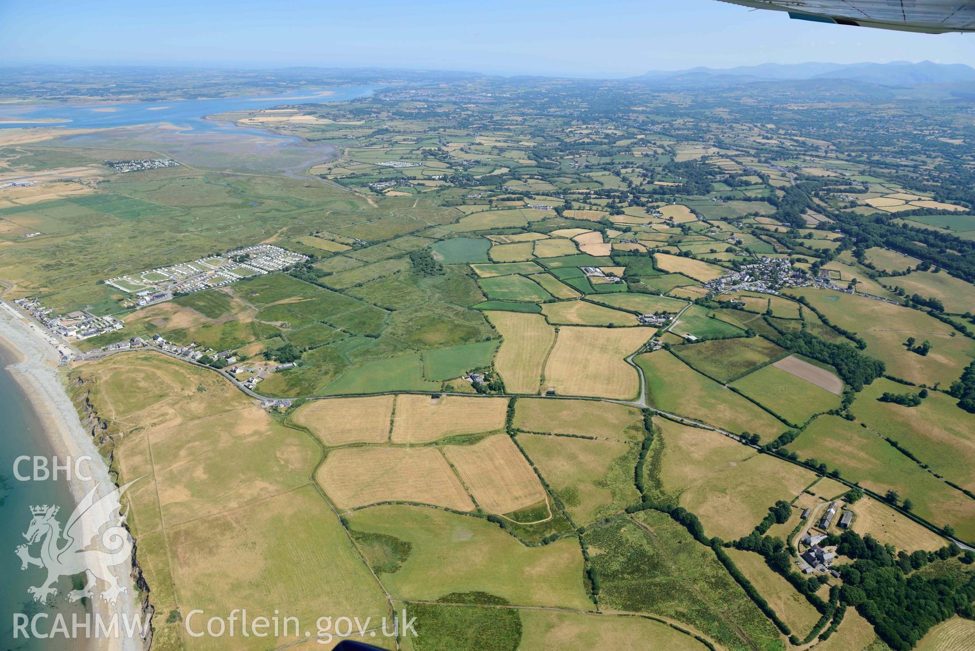 Aerial photograph: Bodfan standing stone, with landscape view to northeast. Crown: CHERISH PROJECT 2018. Produced with EU funds through the Ireland Wales Co-operation Programme 2014-2020 (NGR: SH441553)