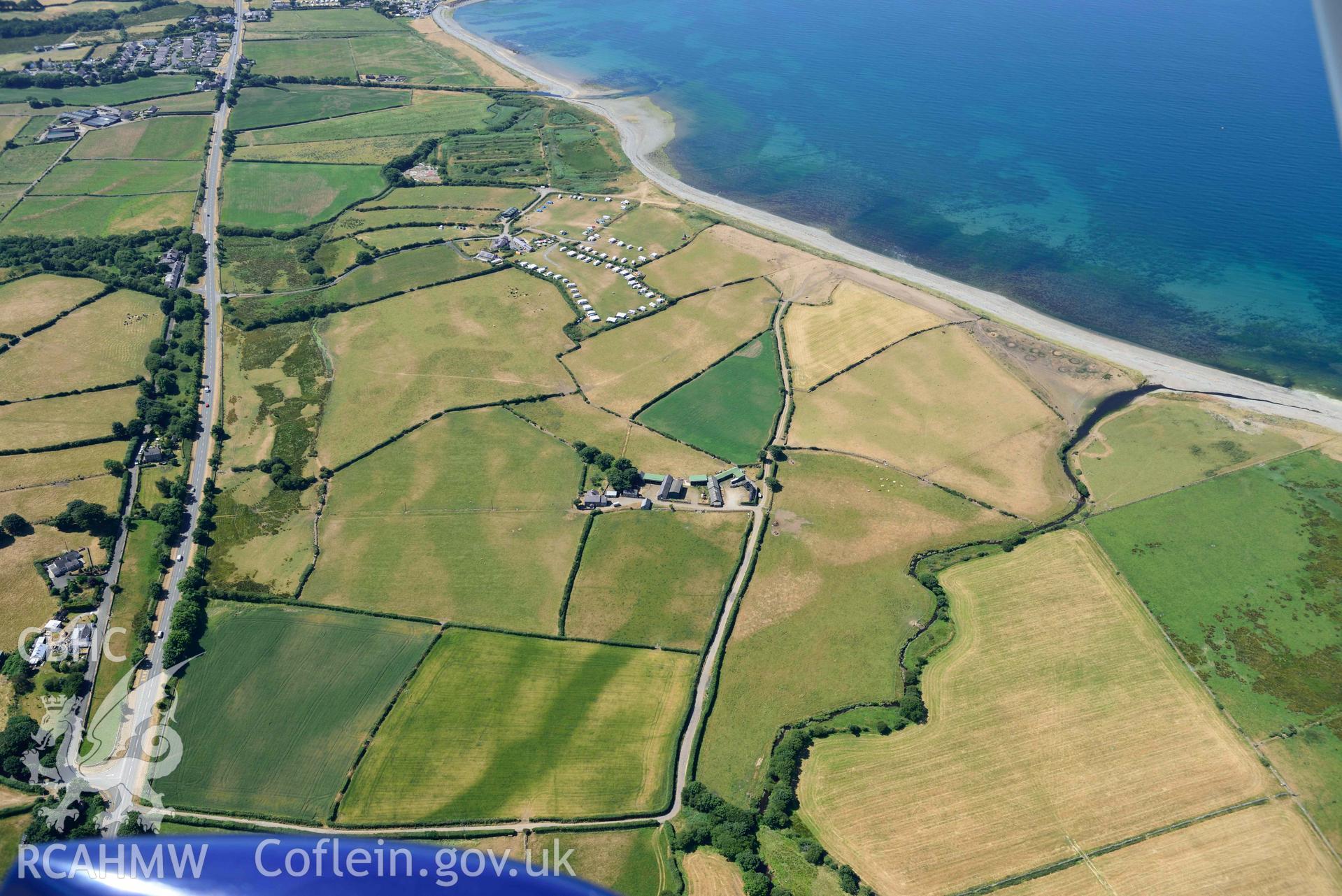 Aerial photograph: Maes Mawr, cropmark enclosure and ring ditch. Crown: CHERISH PROJECT 2018. Produced with EU funds through the Ireland Wales Co-operation Programme 2014-2020 (NGR: SH438536)