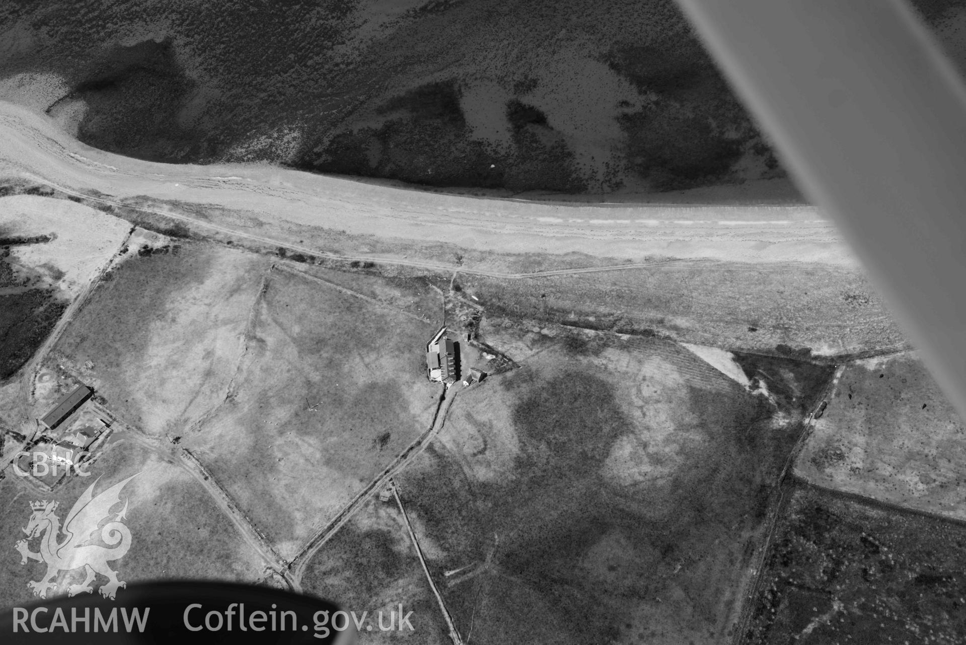 Aerial photograph: Cropmarks of settlement and early fields at Ynys-fach. Crown: CHERISH PROJECT 2018. Produced with EU funds through the Ireland Wales Co-operation Programme 2014-2020 (NGR: SH435544)