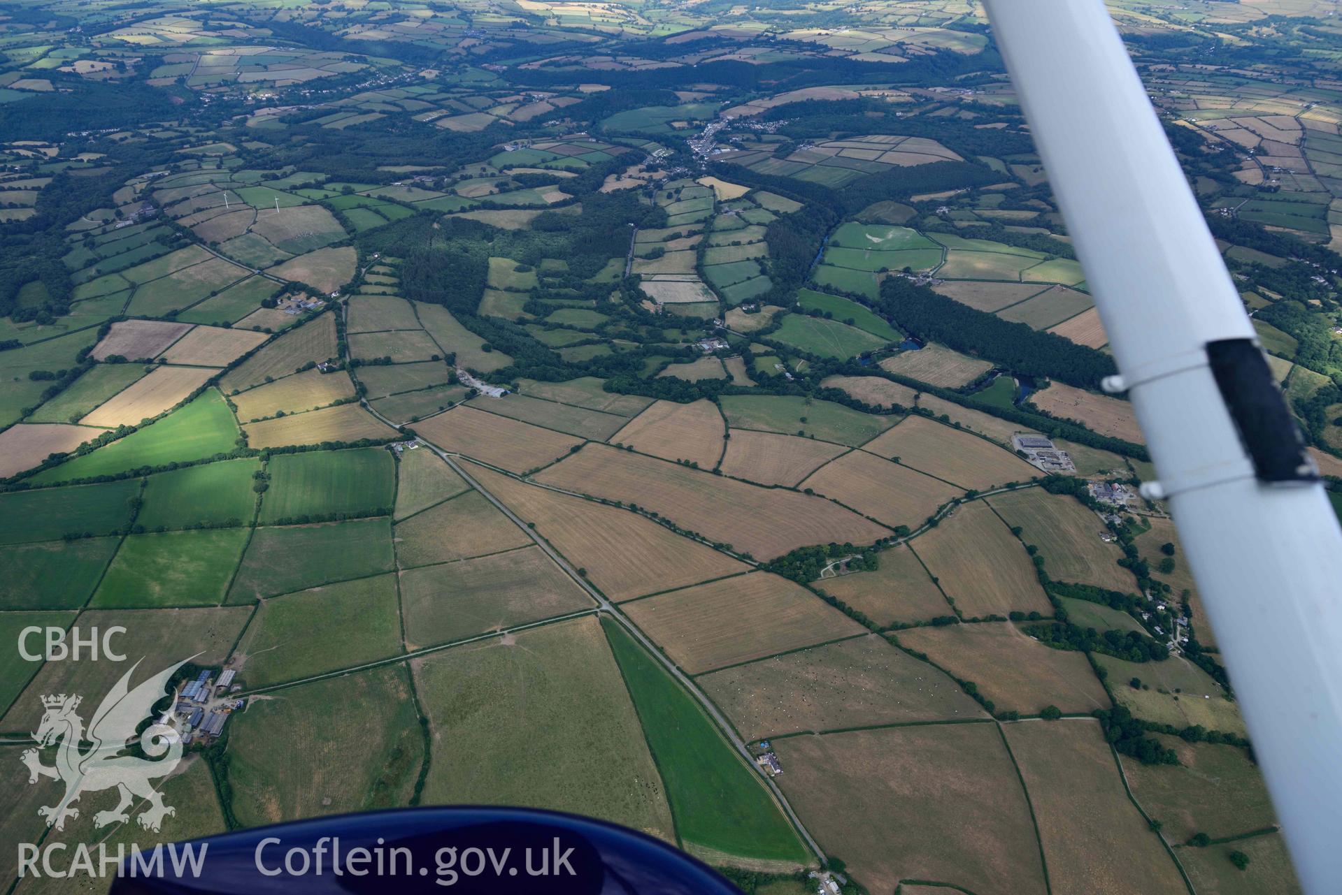 Aerial photograph: Penwaun or Pengelli-fach defended enclosure cropmark. Wide view looking west to Cenarth. Crown: CHERISH PROJECT 2018. Produced with EU funds through the Ireland Wales Co-operation Programme 2014-2020 (NGR: SN293405)