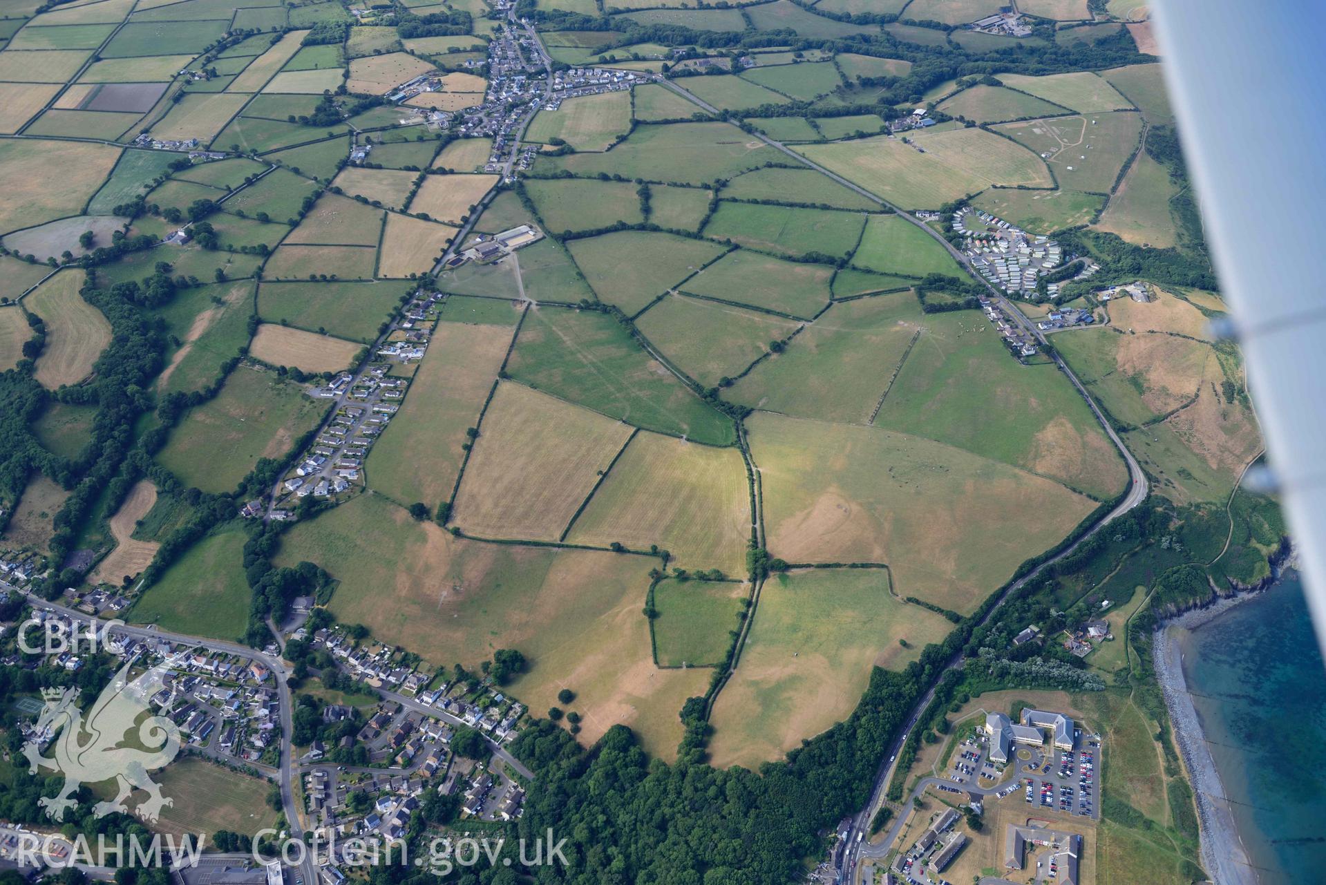 Aerial photograph: Clogfryn defended enclosure, Aberaeron. Crown: CHERISH PROJECT 2018. Produced with EU funds through the Ireland Wales Co-operation Programme 2014-2020 (NGR: SN450623)