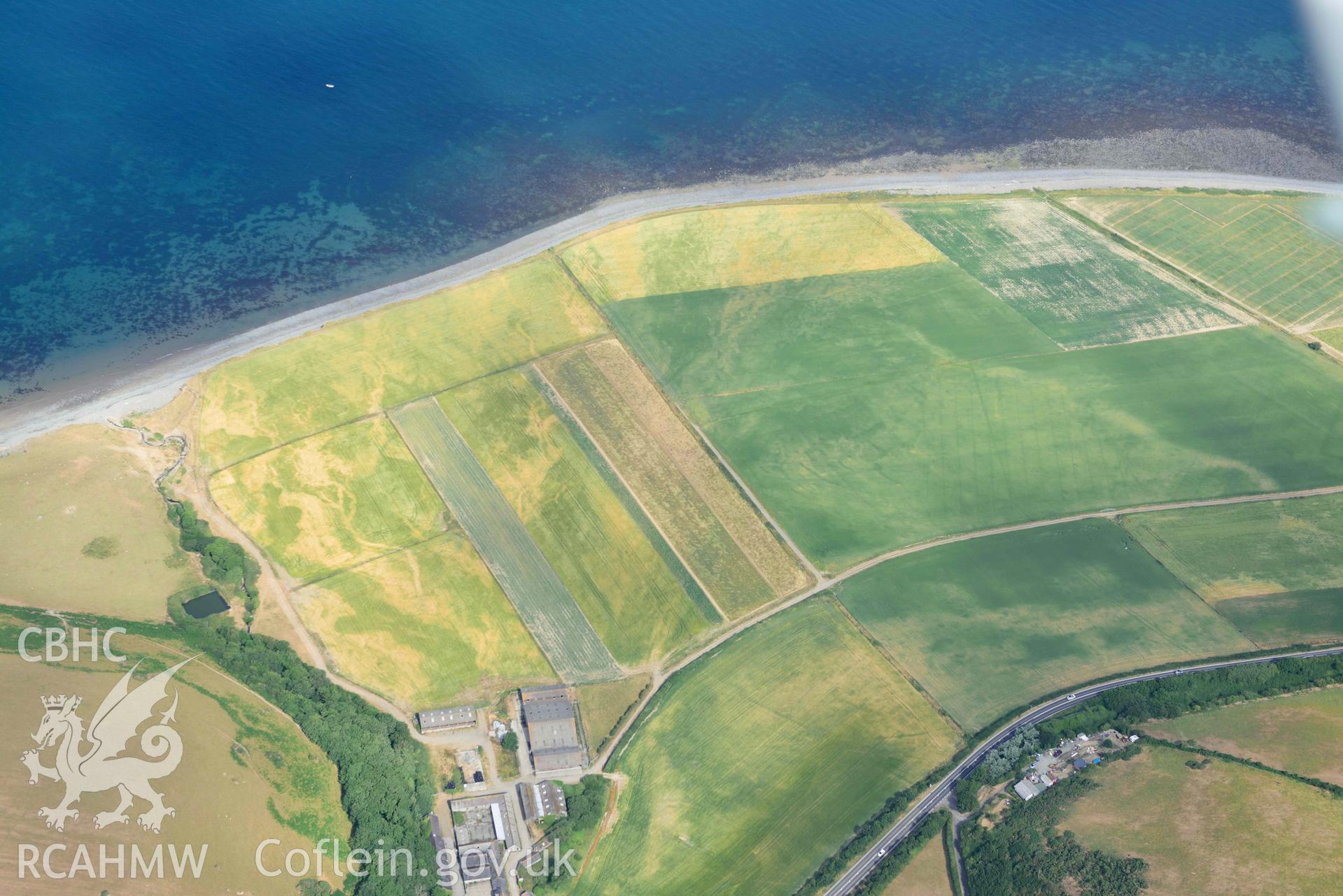 Aerial photograph: Morfa-mawr, natural cropmarks of river channels. Crown: CHERISH PROJECT 2018. Produced with EU funds through the Ireland Wales Co-operation Programme 2014-2020 (NGR: SN503656)