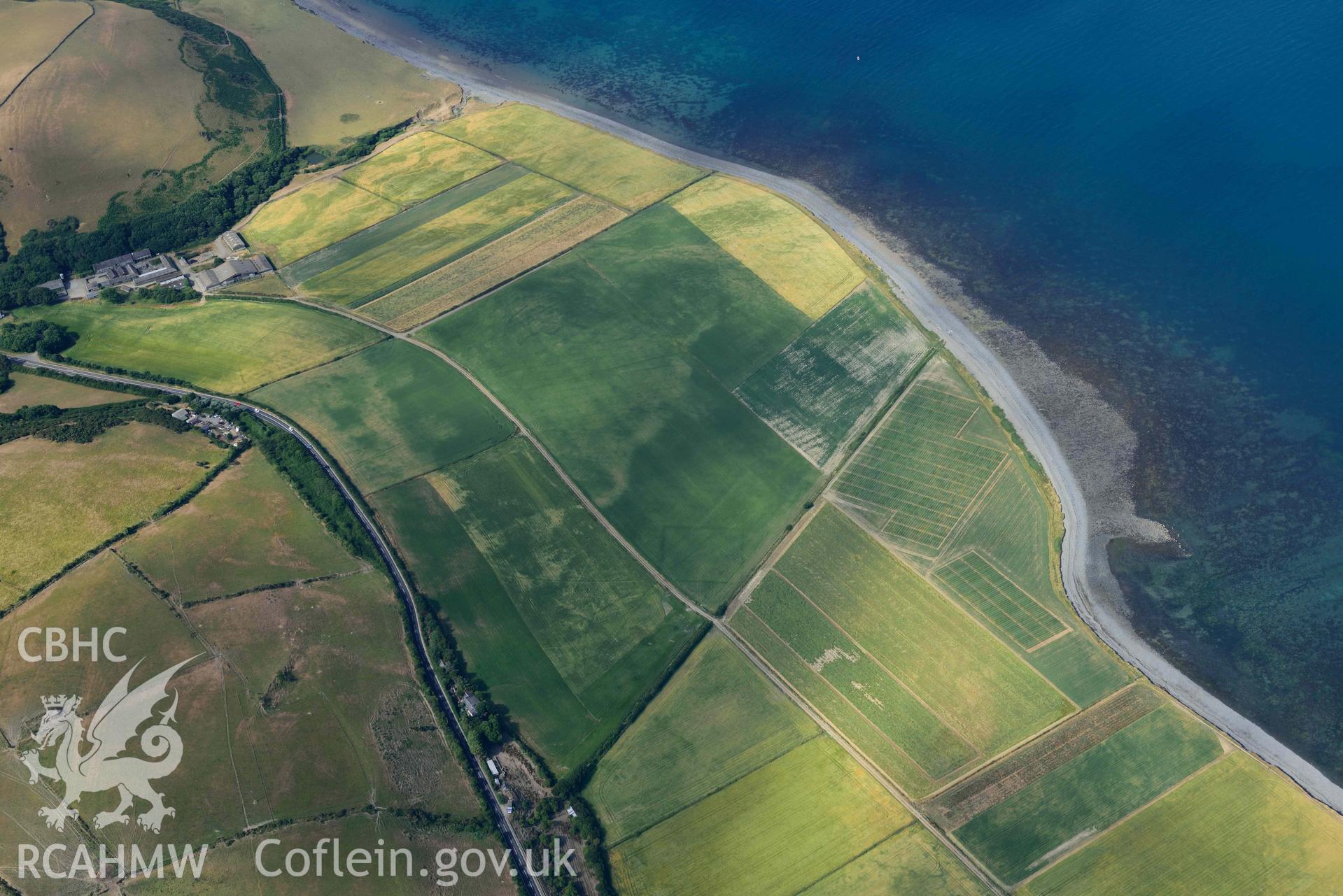 Aerial photograph: Llanon defended enclosure, Morfa Mawr. Crown: CHERISH PROJECT 2018. Produced with EU funds through the Ireland Wales Co-operation Programme 2014-2020 (NGR: SN505662)