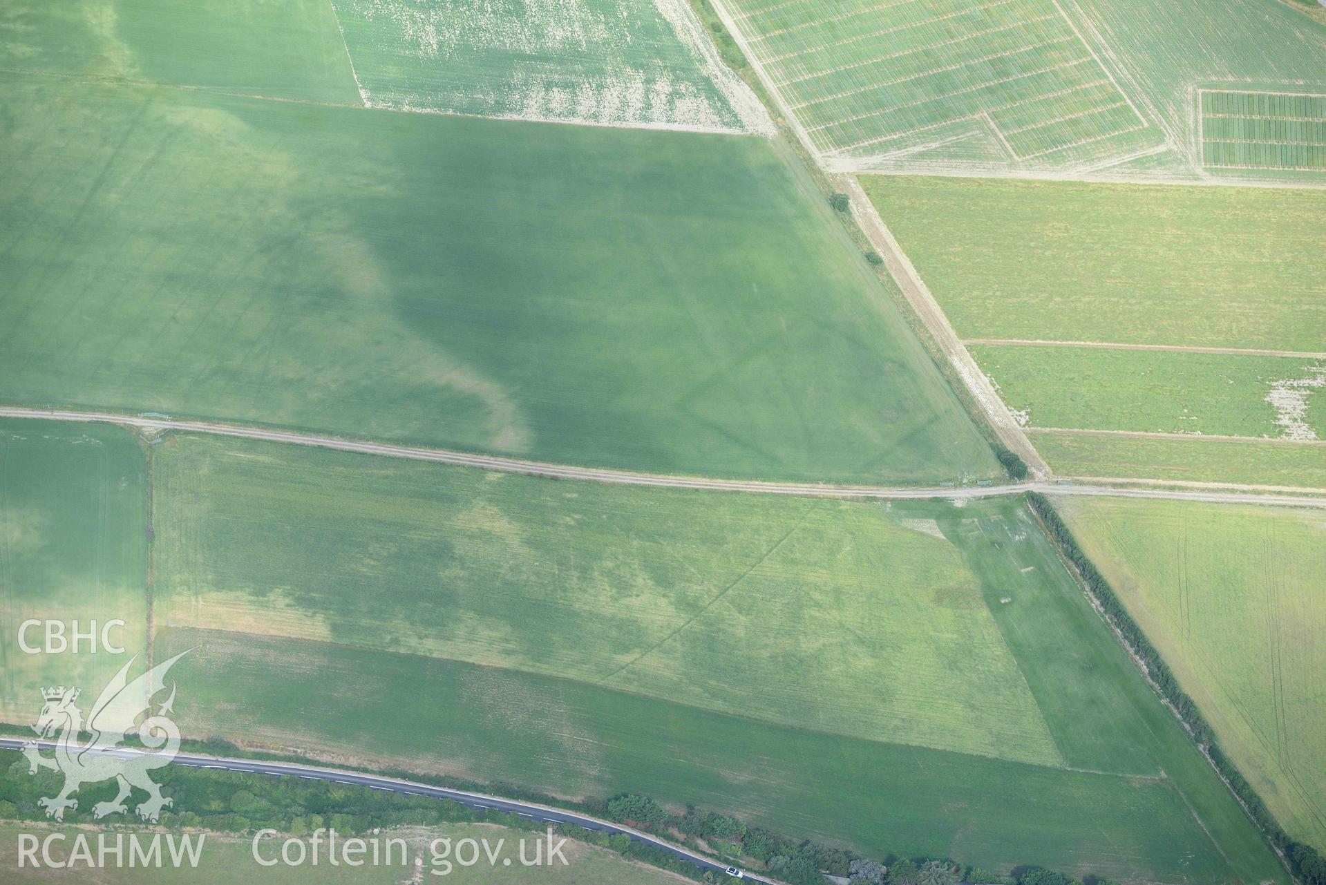 Aerial photograph: Llanon defended enclosure, Morfa Mawr. Crown: CHERISH PROJECT 2018. Produced with EU funds through the Ireland Wales Co-operation Programme 2014-2020 (NGR: SN505662)