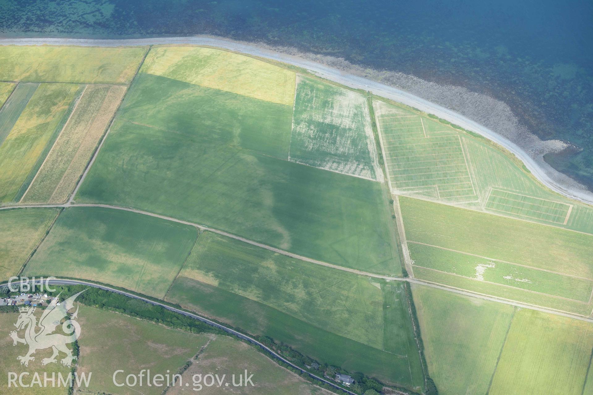 Aerial photograph: Llanon defended enclosure, Morfa Mawr. Crown: CHERISH PROJECT 2018. Produced with EU funds through the Ireland Wales Co-operation Programme 2014-2020 (NGR: SN505662)