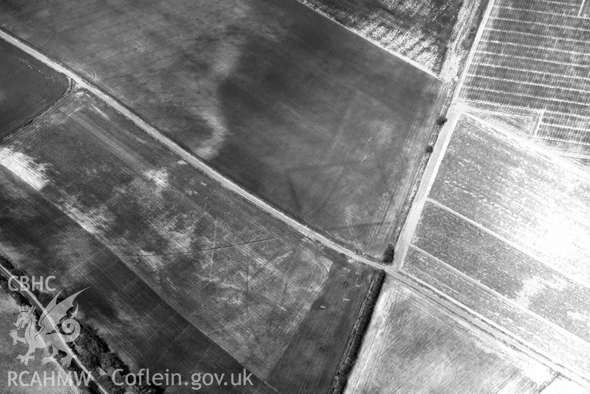 Aerial photograph: Llanon defended enclosure, Morfa Mawr. Crown: CHERISH PROJECT 2018. Produced with EU funds through the Ireland Wales Co-operation Programme 2014-2020 (NGR: SN505662)