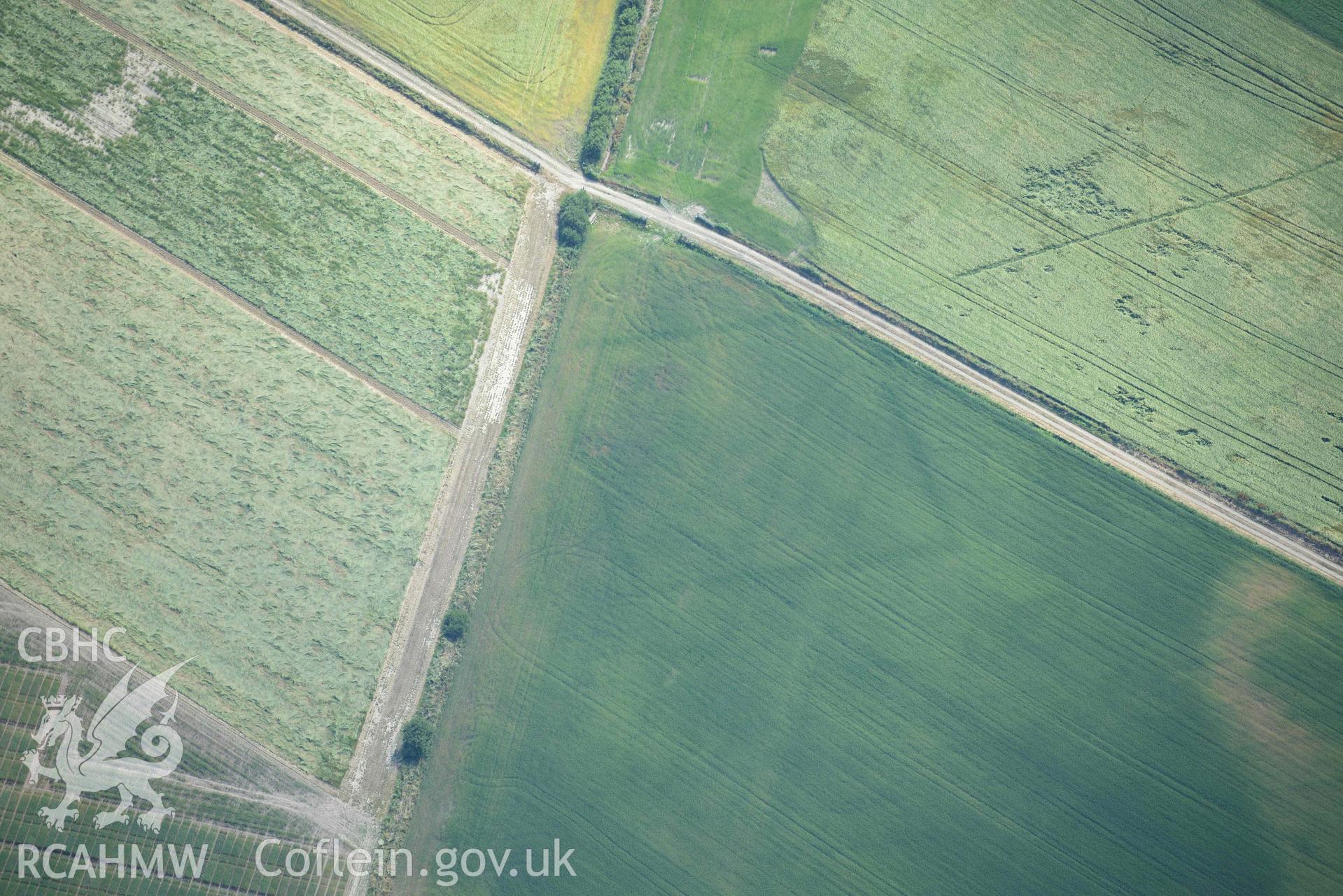 Aerial photograph: Llanon defended enclosure, Morfa Mawr. Crown: CHERISH PROJECT 2018. Produced with EU funds through the Ireland Wales Co-operation Programme 2014-2020 (NGR: SN505662)