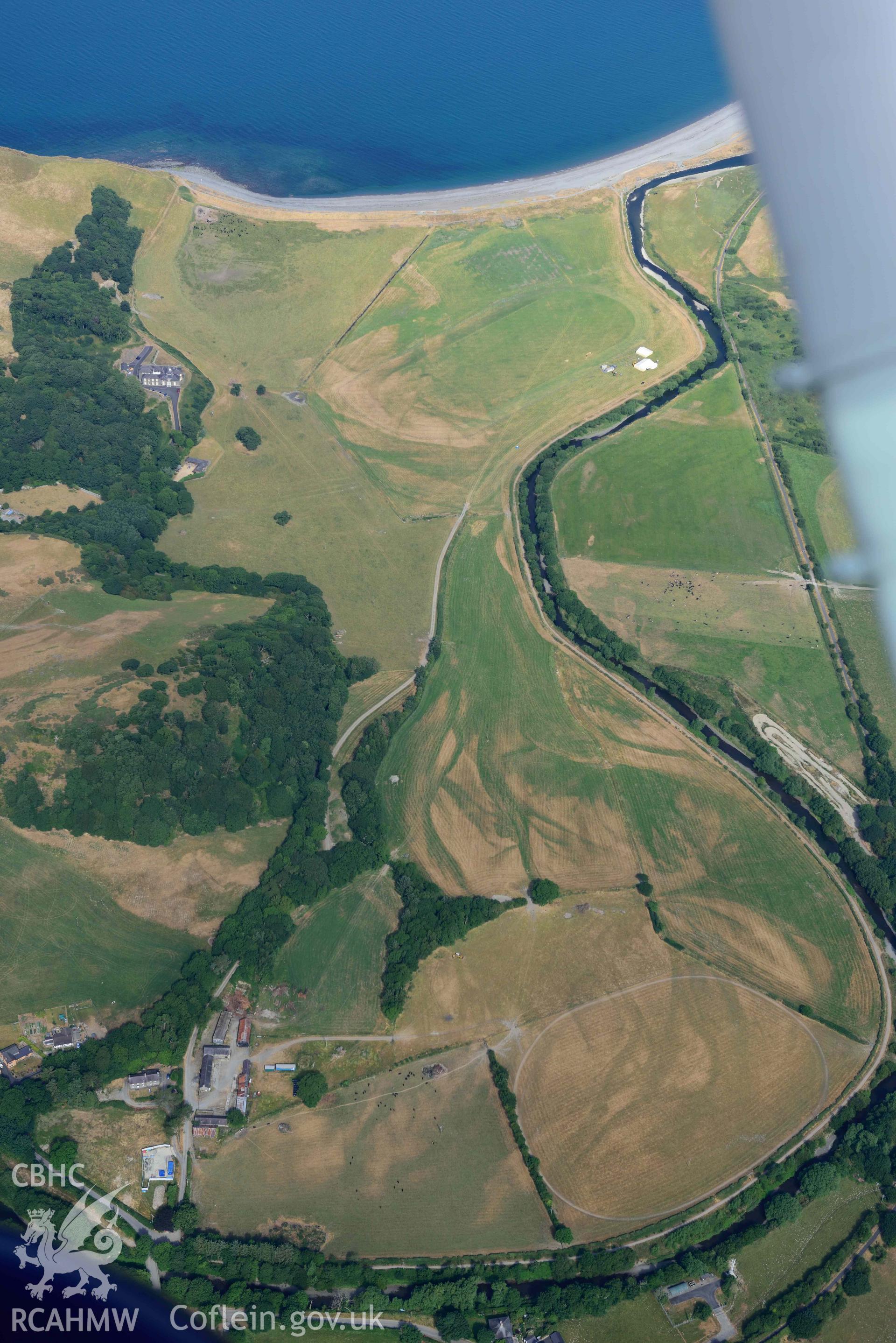 Aerial photograph: Riverine parchmarks at Tanybwlch, view from the southeast. Crown: CHERISH PROJECT 2018. Produced with EU funds through the Ireland Wales Co-operation Programme 2014-2020 (NGR: SN582796)