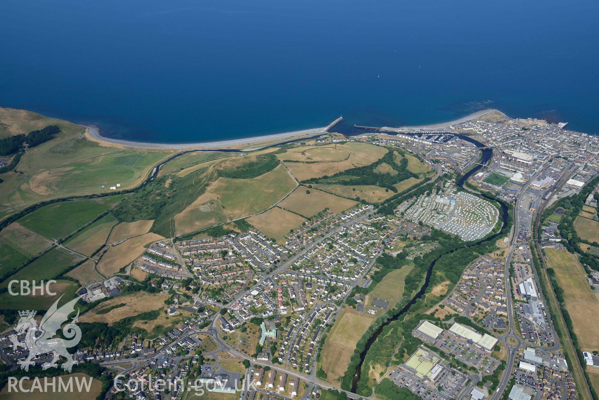 Aerial photograph: Pendinas hillfort, and Aberystwyth, in drought conditions. Crown: CHERISH PROJECT 2018. Produced with EU funds through the Ireland Wales Co-operation Programme 2014-2020 (NGR: SN584802)