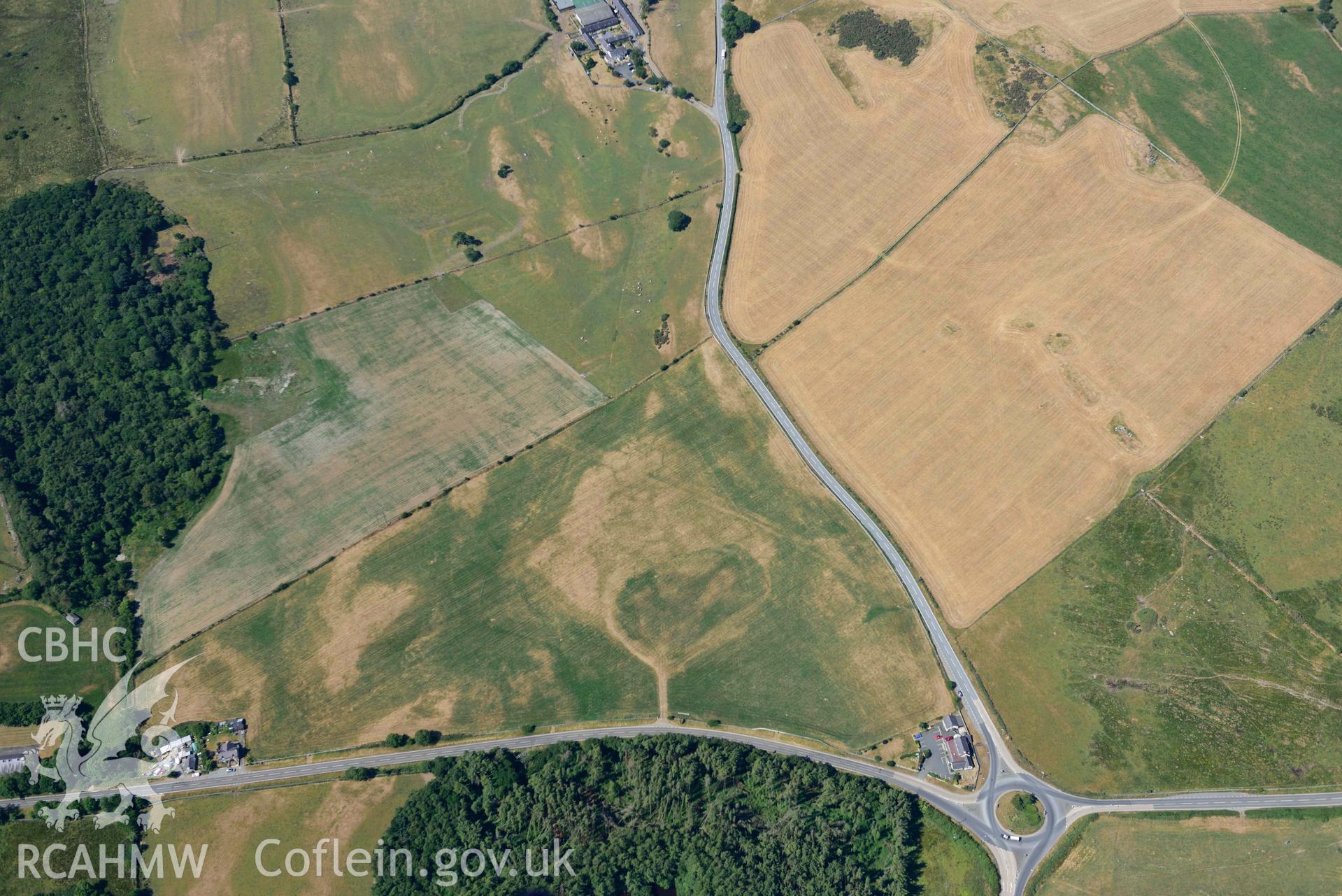 Aerial photograph: Moat at Coed Ty Mawr, and surrounding parchmarks. Crown: CHERISH PROJECT 2018. Produced with EU funds through the Ireland Wales Co-operation Programme 2014-2020 (NGR: SH555664)