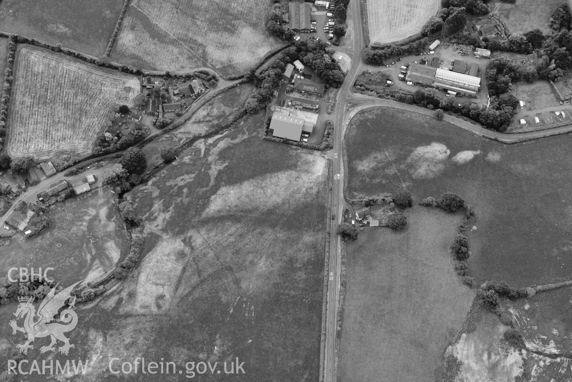 Aerial photograph: Bryncrug, Pont y Felindre cropmark complex. Crown: CHERISH PROJECT 2018. Produced with EU funds through the Ireland Wales Co-operation Programme 2014-2020 (NGR SH616031)