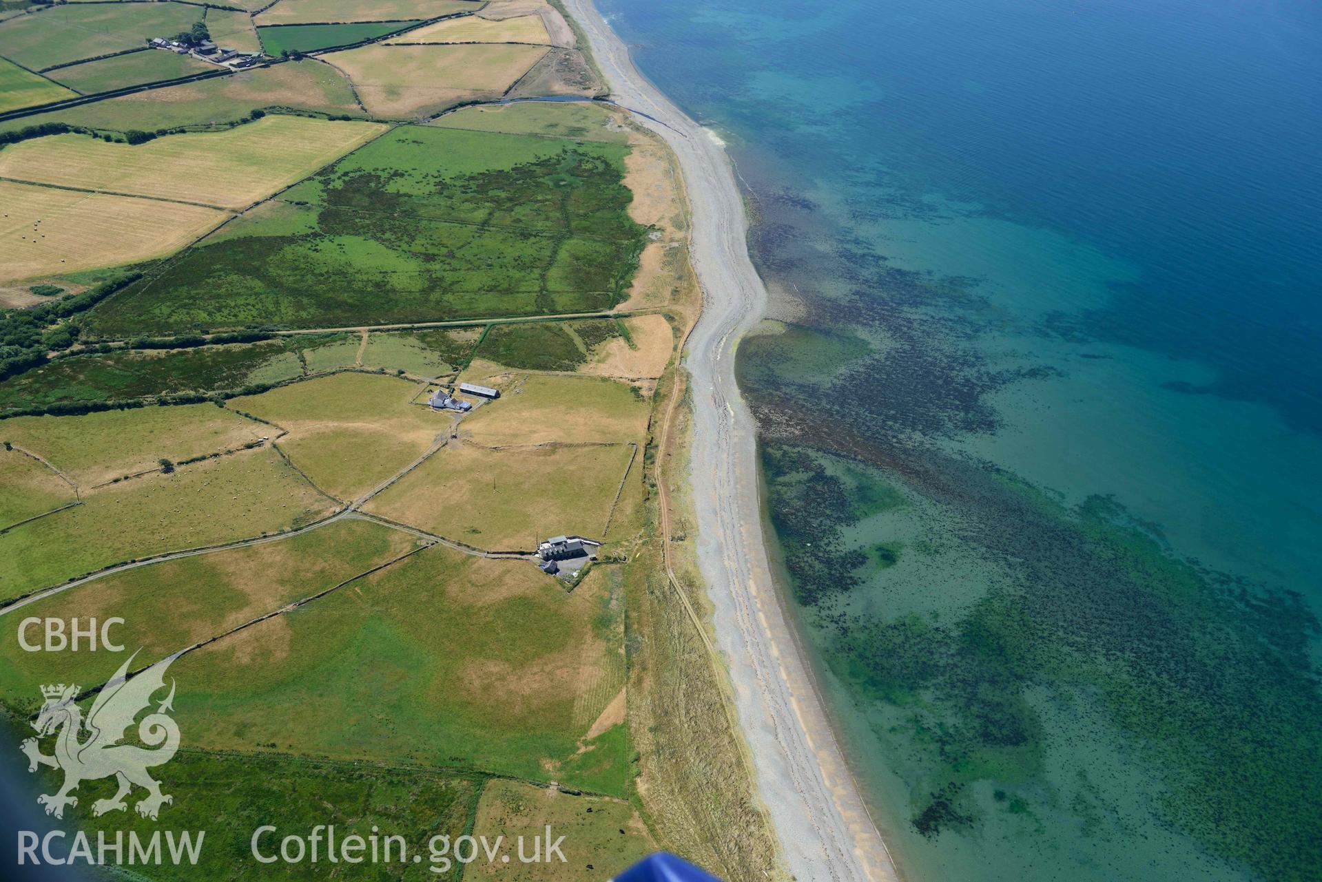 Aerial photograph: Cropmarks of settlement and early fields at Ynys-fach, coastal landscape looking south. Crown: CHERISH PROJECT 2018. Produced with EU funds through the Ireland Wales Co-operation Programme 2014-2020 (NGR: SH435544)