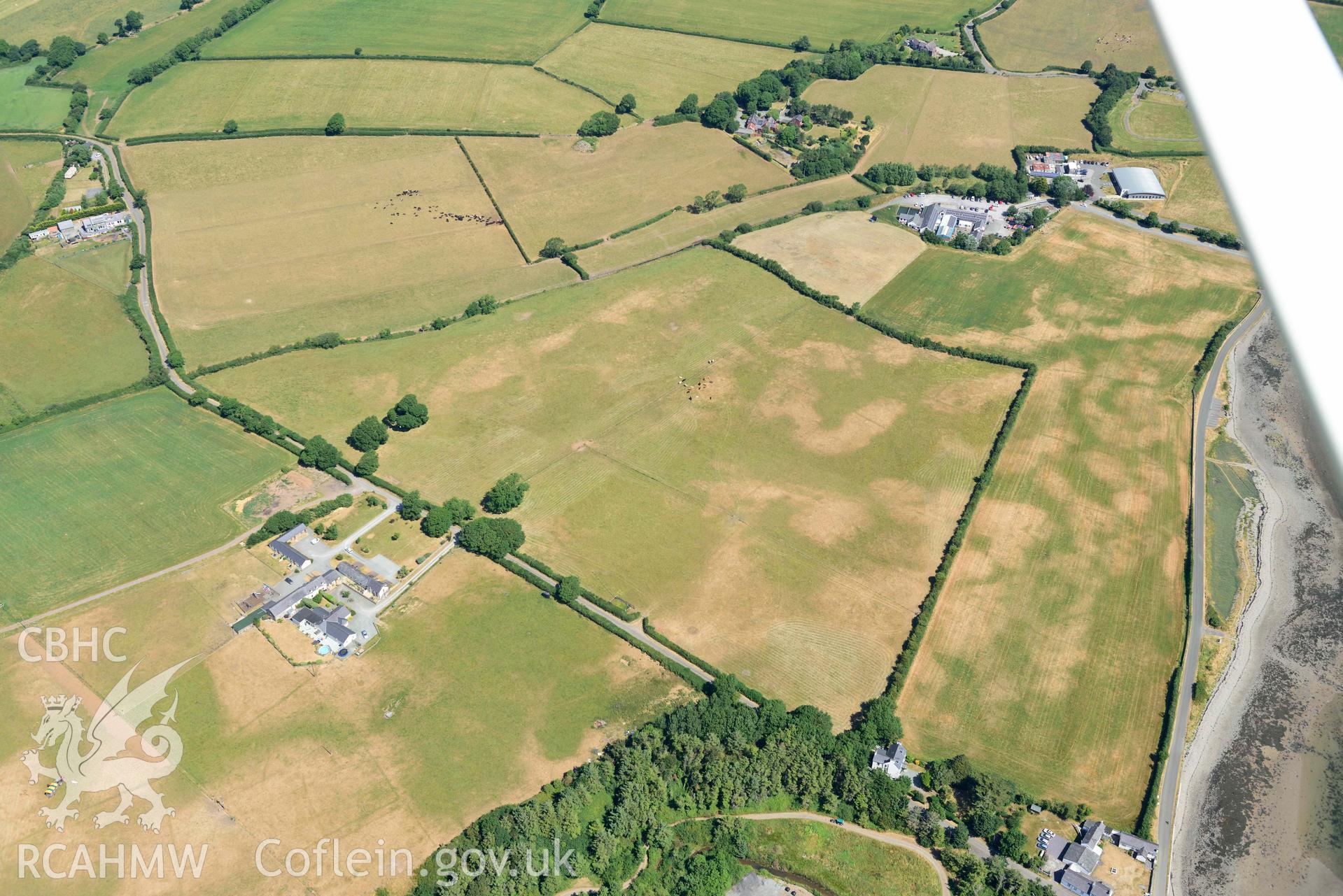 Aerial photograph: Tai Cochion Roman settlement, parchmarks of boundaries. Crown: CHERISH PROJECT 2018. Produced with EU funds through the Ireland Wales Co-operation Programme 2014-2020 (NGR: SH479656)