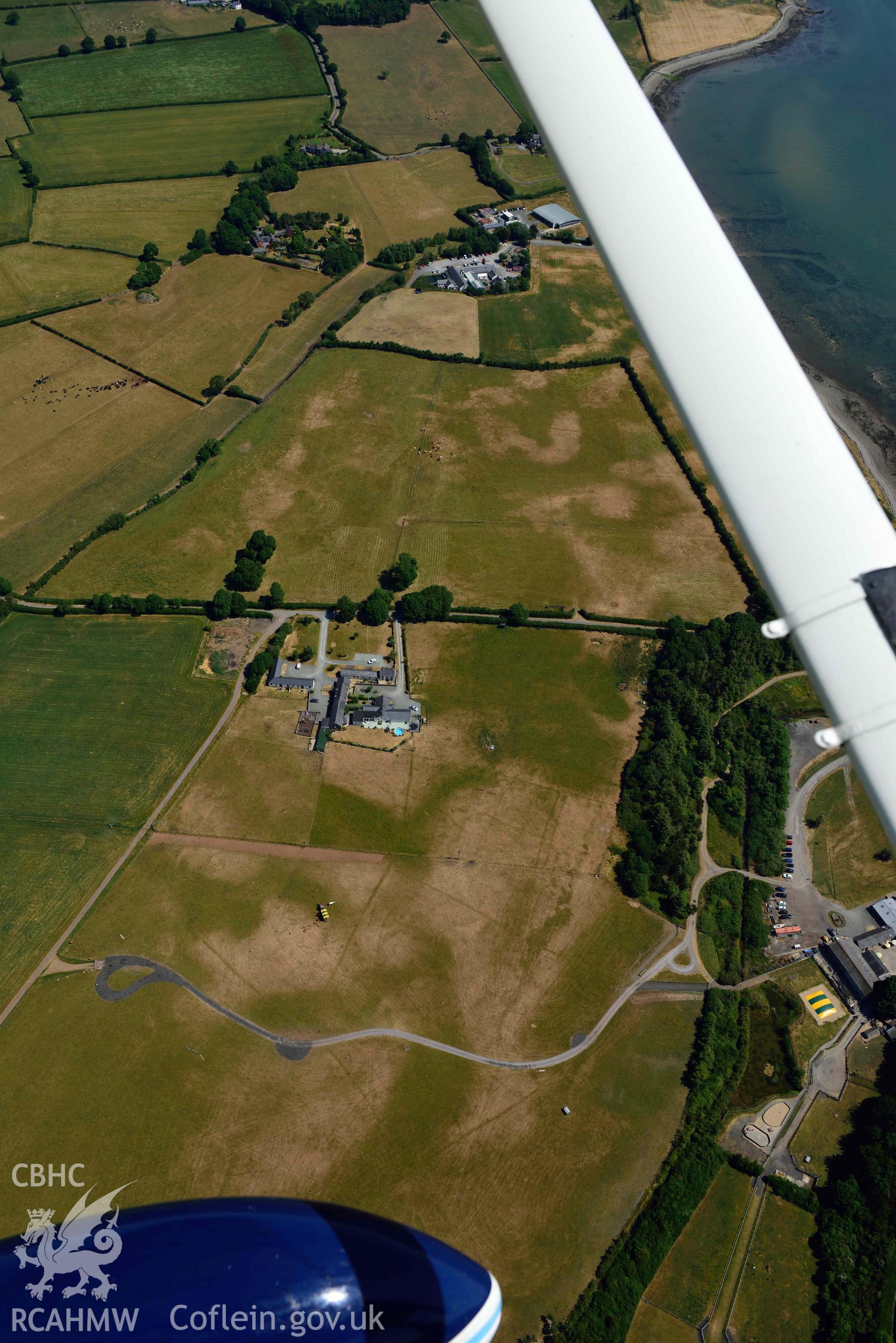 Aerial photograph: Tai Cochion Roman settlement, parchmarks of boundaries. Crown: CHERISH PROJECT 2018. Produced with EU funds through the Ireland Wales Co-operation Programme 2014-2020 (NGR: SH479656)