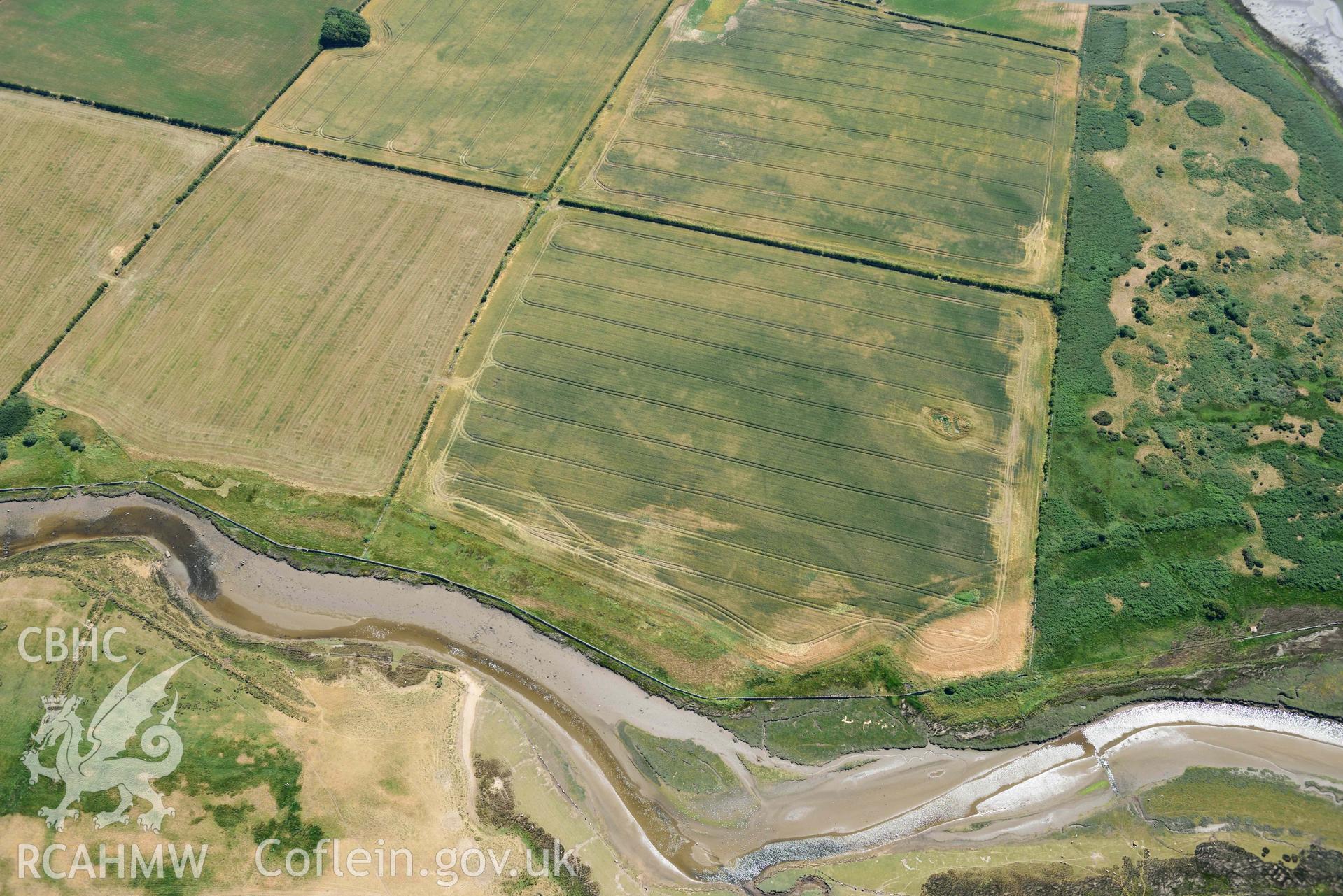 Aerial photograph: Cropmarks at Rhuddgaer. Crown: CHERISH PROJECT 2018. Produced with EU funds through the Ireland Wales Co-operation Programme 2014-2020 (NGR: SH441638)