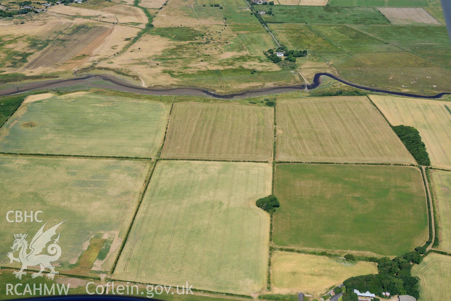 Aerial photograph: Cropmarks at Rhuddgaer. Crown: CHERISH PROJECT 2018. Produced with EU funds through the Ireland Wales Co-operation Programme 2014-2020 (NGR: SH441638)