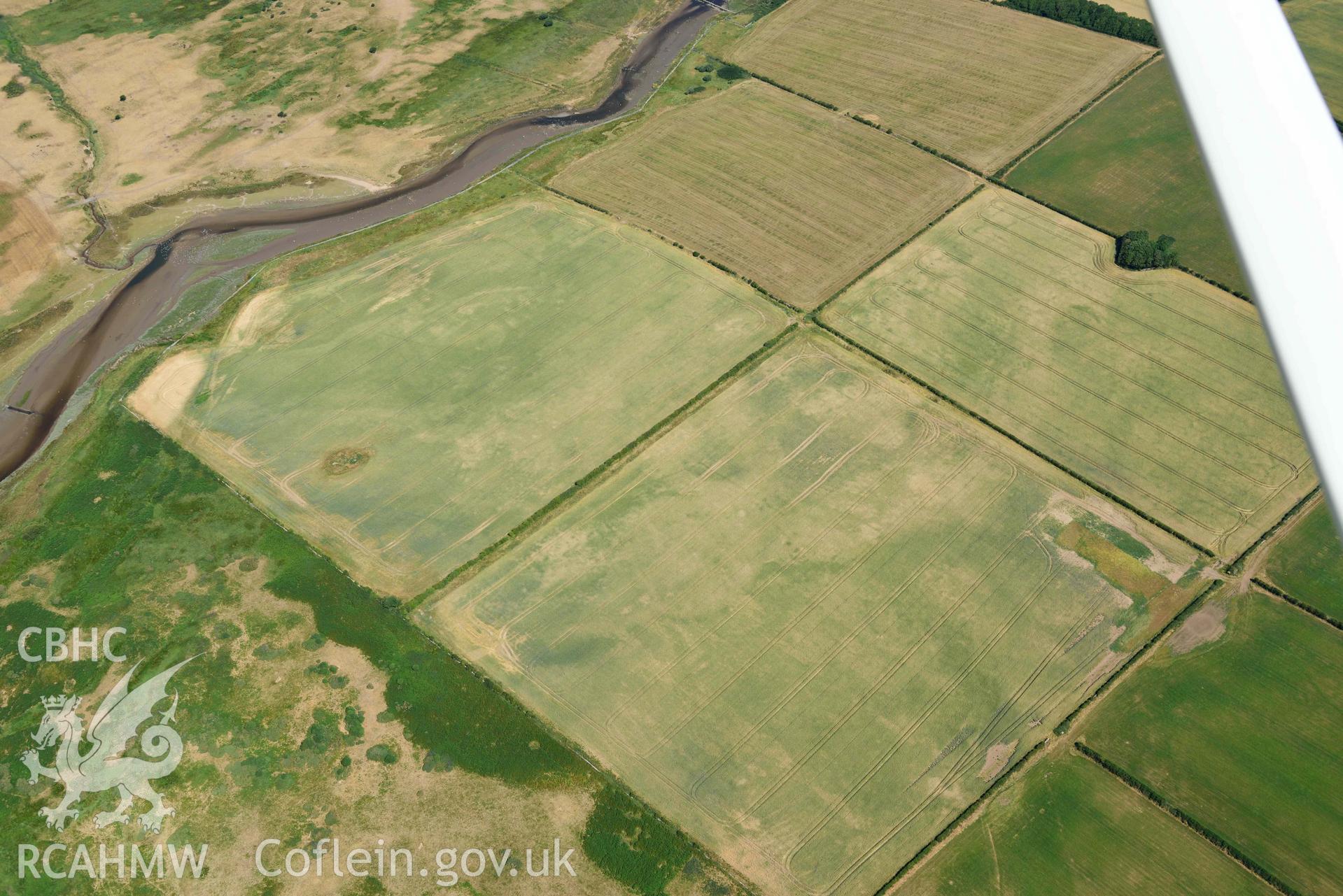 Aerial photograph: Cropmarks at Rhuddgaer. Crown: CHERISH PROJECT 2018. Produced with EU funds through the Ireland Wales Co-operation Programme 2014-2020 (NGR: SH441638)