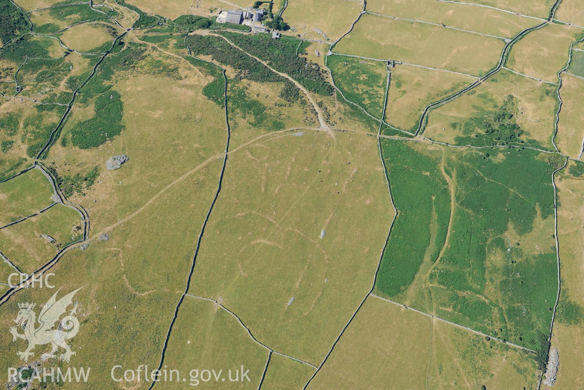 Aerial photograph: Hendre Coed Uchaf concentric homesteads, with parchmarks. Crown: CHERISH PROJECT 2018. Produced with EU funds through the Ireland Wales Co-operation Programme 2014-2020 (NGR: SH607181)