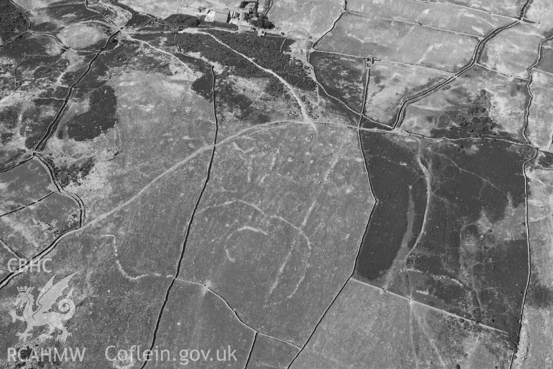 Aerial photograph: Hendre Coed Uchaf concentric homesteads, with parchmarks. Crown: CHERISH PROJECT 2018. Produced with EU funds through the Ireland Wales Co-operation Programme 2014-2020 (NGR: SH607181)