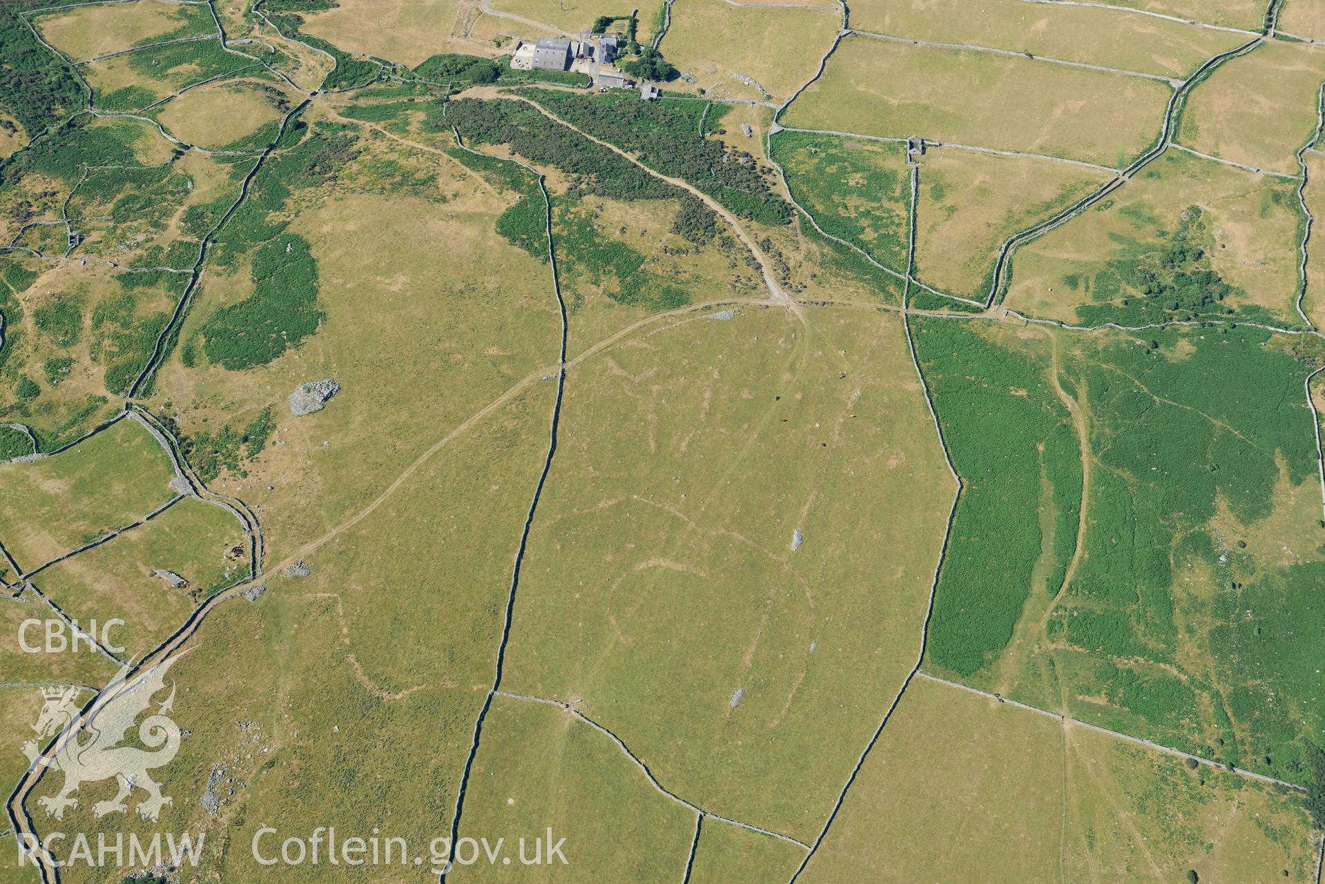 Aerial photograph: Hendre Coed Uchaf concentric homesteads, with parchmarks. Crown: CHERISH PROJECT 2018. Produced with EU funds through the Ireland Wales Co-operation Programme 2014-2020 (NGR: SH607181)