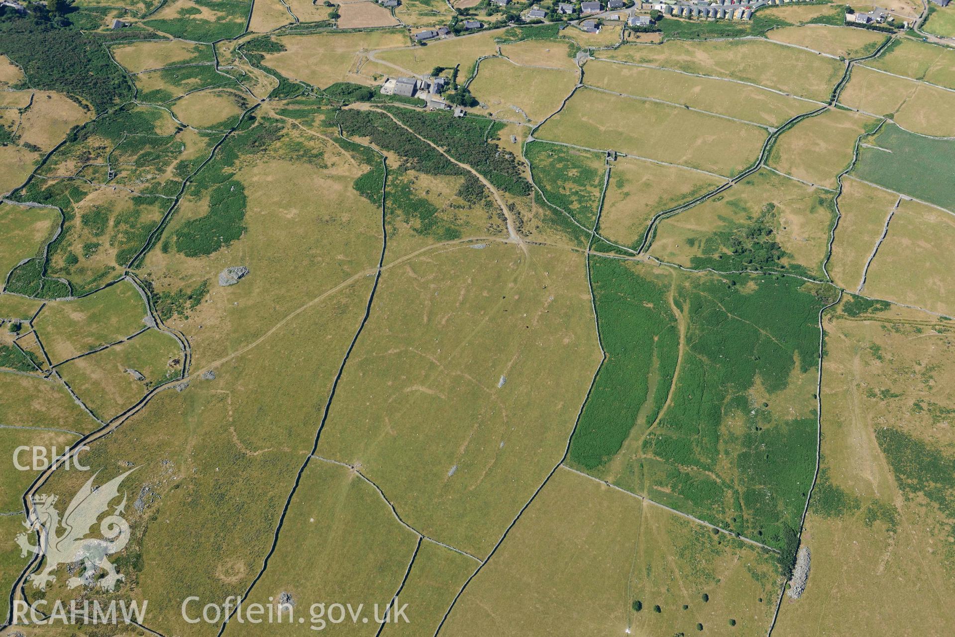 Aerial photograph: Hendre Coed Uchaf concentric homesteads, with parchmarks. Crown: CHERISH PROJECT 2018. Produced with EU funds through the Ireland Wales Co-operation Programme 2014-2020 (NGR: SH607181)