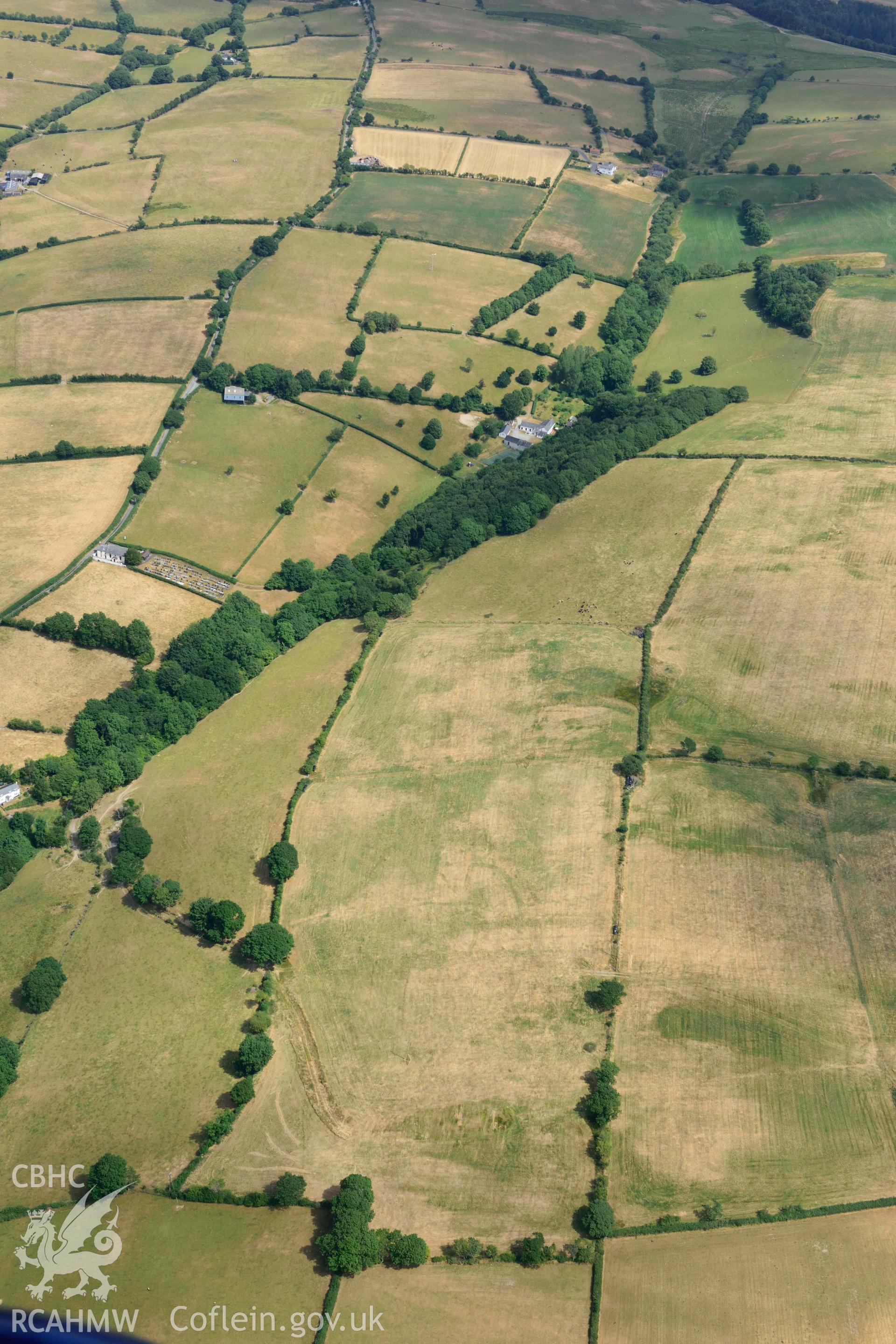 Aerial photograph: Gellifadog defended enclosure cropmark, view from west. Crown: CHERISH PROJECT 2018. Produced with EU funds through the Ireland Wales Co-operation Programme 2014-2020 (NGR SN654821)