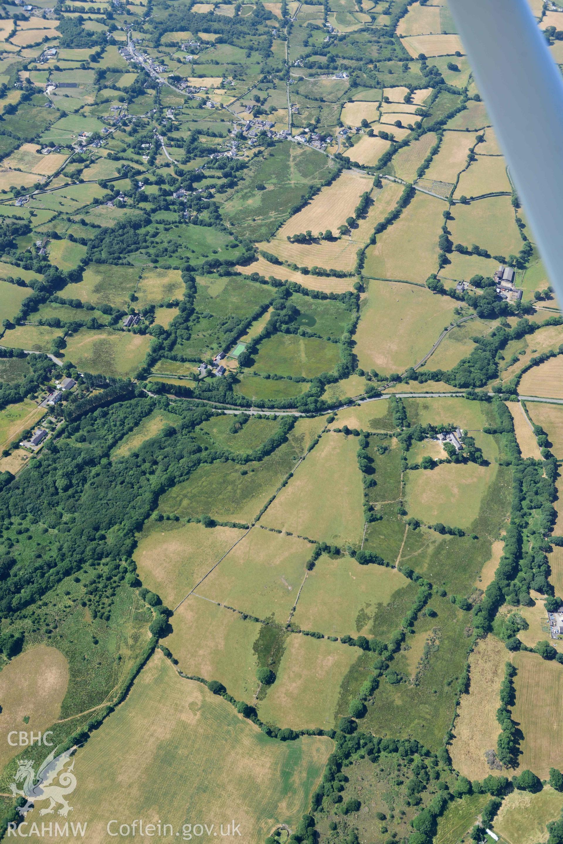 Aerial photograph: Roman road passing through Rhos Isaf. Parchmarks at Dolau Gwyn. Crown: CHERISH PROJECT 2018. Produced with EU funds through the Ireland Wales Co-operation Programme 2014-2020 (NGR: SH489586)