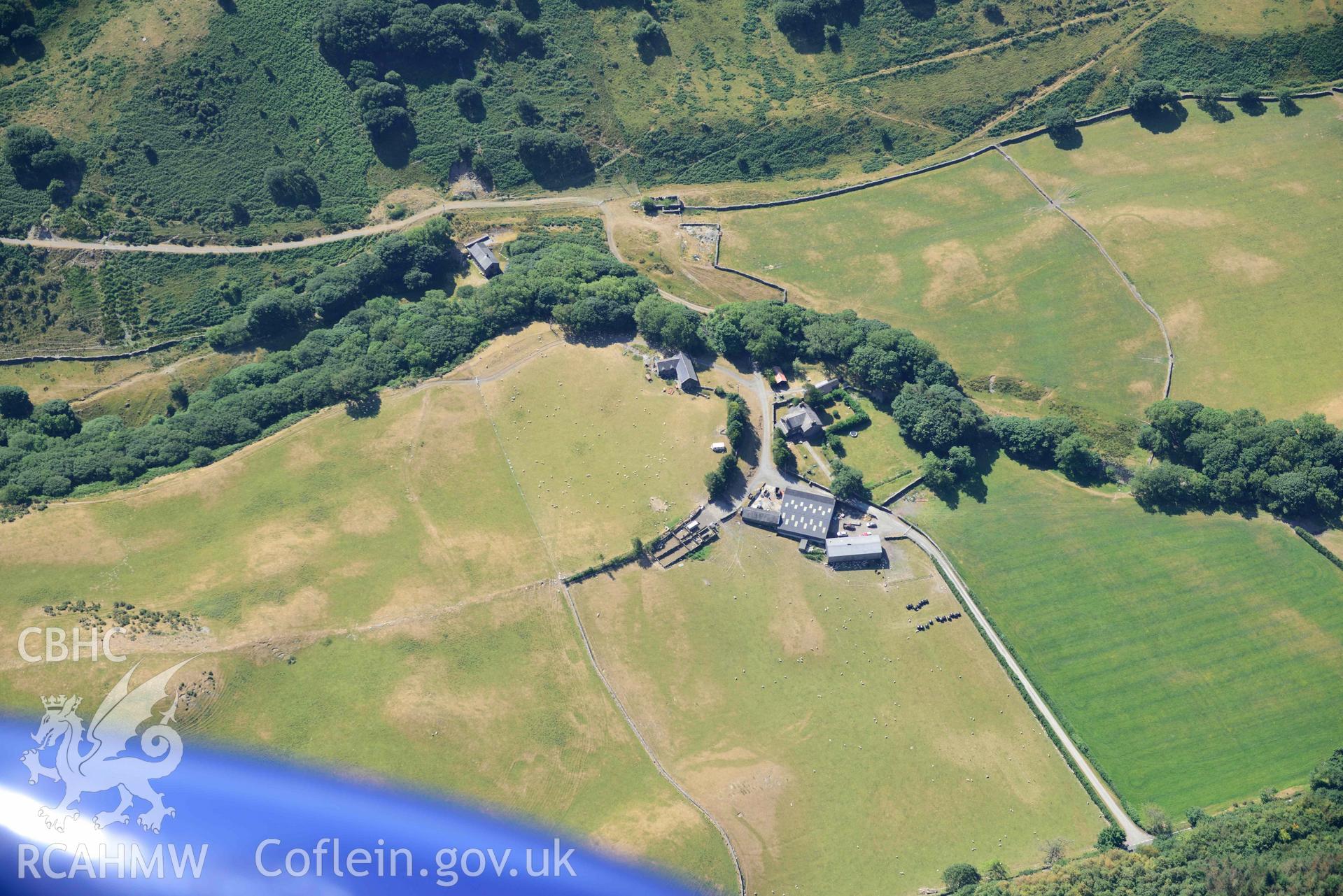 Aerial photograph: Maes y Pandy, cropmarks of quarry pits and trackways. Crown: CHERISH PROJECT 2018. Produced with EU funds through the Ireland Wales Co-operation Programme 2014-2020 (NGR: SH703087)