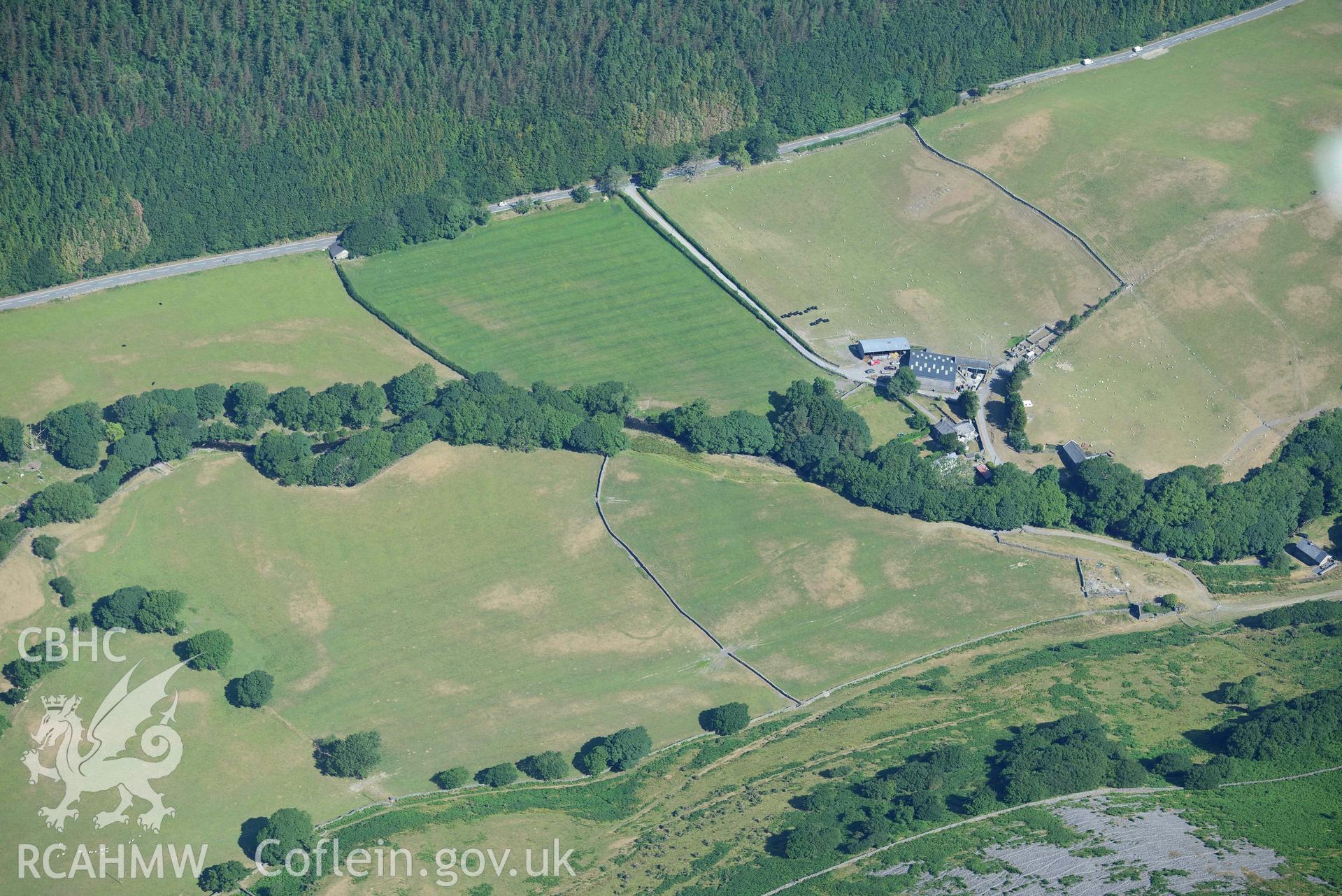 Aerial photograph: Maes y Pandy, cropmarks of quarry pits and trackways. Crown: CHERISH PROJECT 2018. Produced with EU funds through the Ireland Wales Co-operation Programme 2014-2020 (NGR: SH703087)