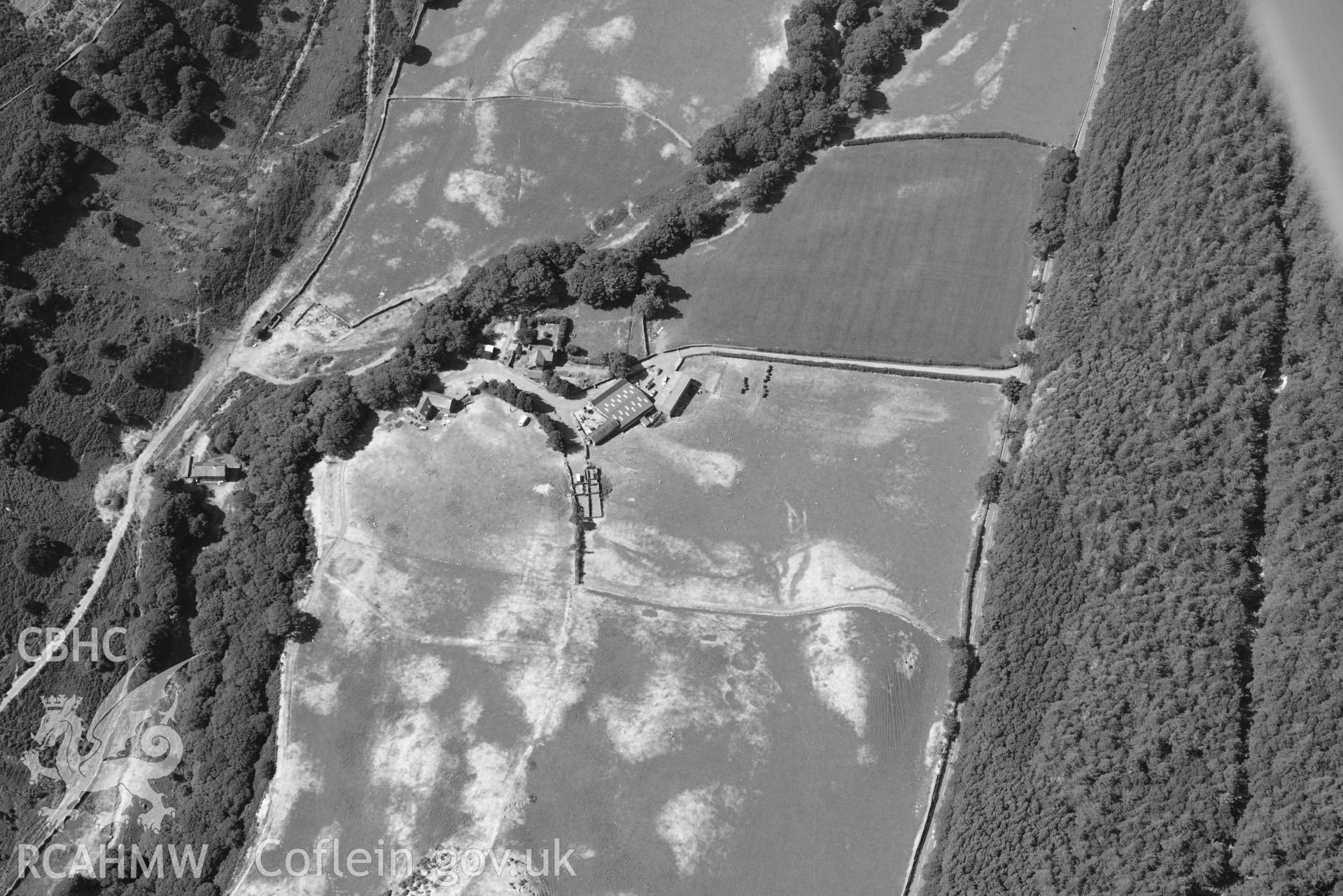 Aerial photograph: Maes y Pandy, cropmarks of quarry pits and trackways. Crown: CHERISH PROJECT 2018. Produced with EU funds through the Ireland Wales Co-operation Programme 2014-2020 (NGR: SH703087)