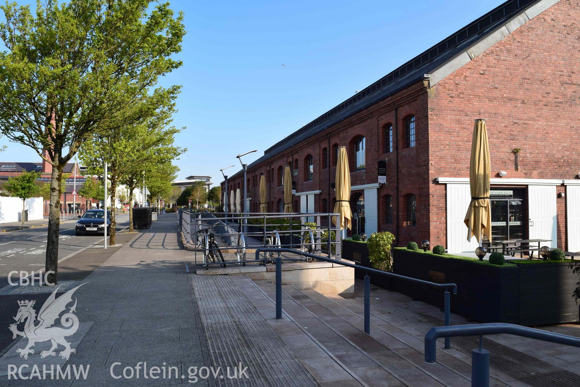 Photograph from an assessment of heritage impact on the setting of the J Shed Listed Building of seating at the Rasoi Waterfront restaurant, Waterfront, Swansea, carried out by Trysor in 2021. Trysor Project No. 2021/783.