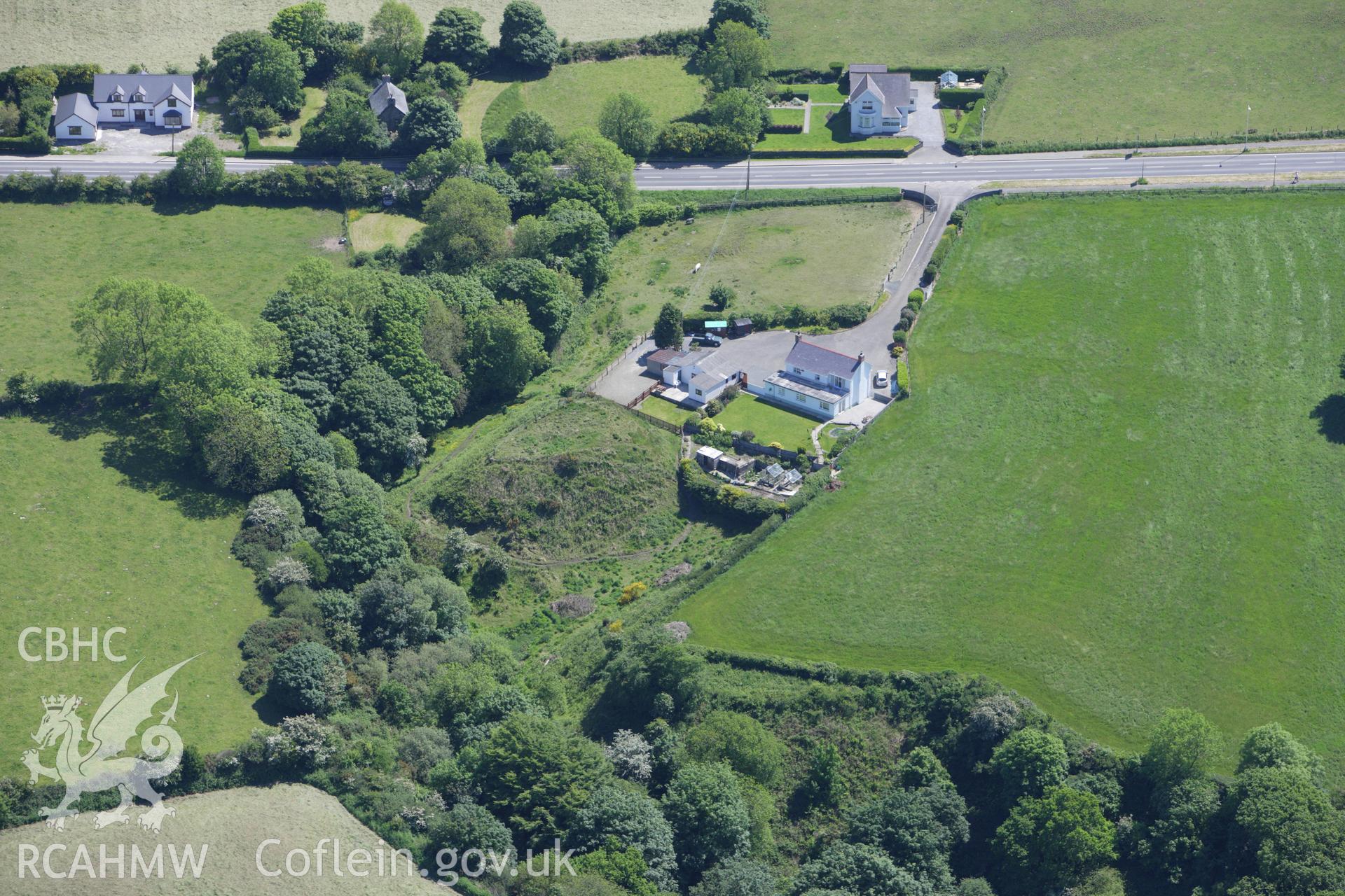 RCAHMW colour oblique aerial photograph of Blaenporth Castle. Taken on 01 June 2009 by Toby Driver