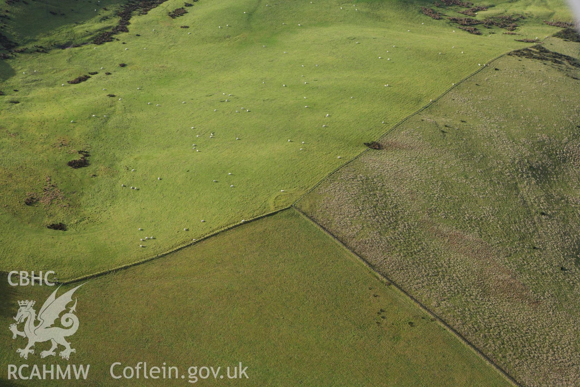 RCAHMW colour oblique aerial photograph of Castell-y-Garn Cairn. Taken on 10 December 2009 by Toby Driver