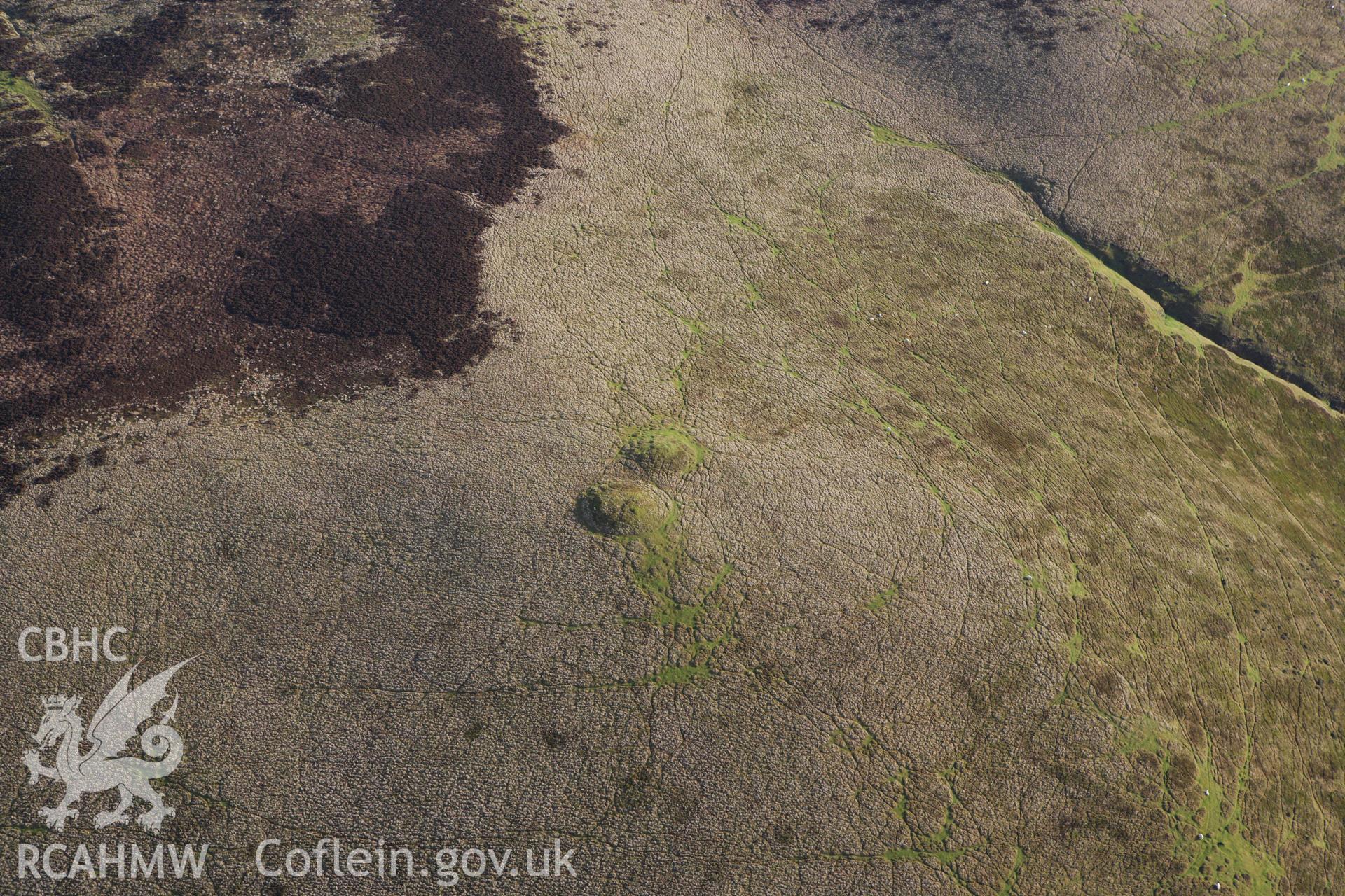 RCAHMW colour oblique aerial photograph of Rhos Crug Barrow II. Taken on 10 December 2009 by Toby Driver